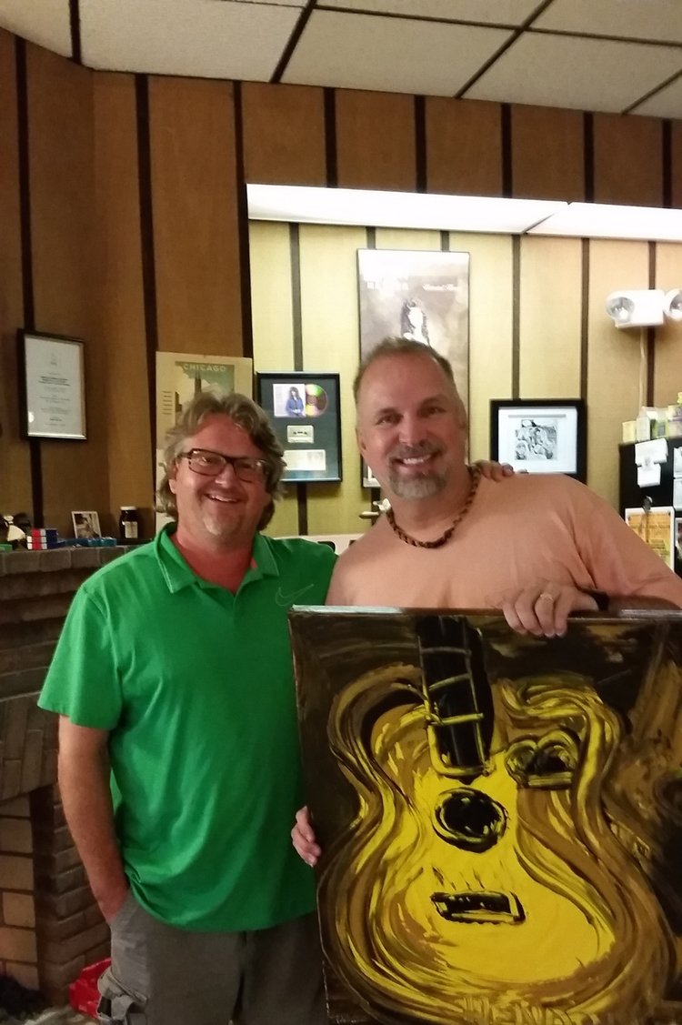 Garth Brooks with his personal Hendon Painting. 