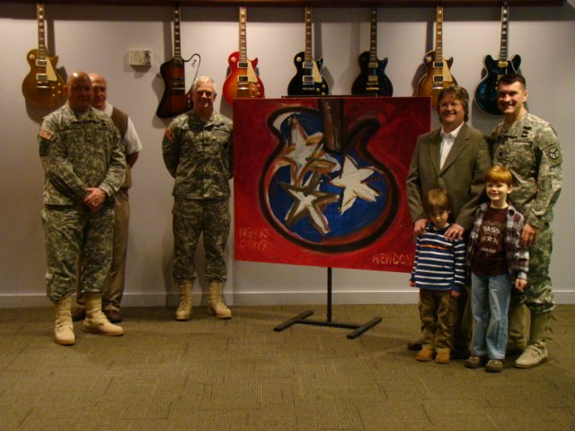  National Guard General receiving a Hendon painting at the Country Music Hall of Fame.  