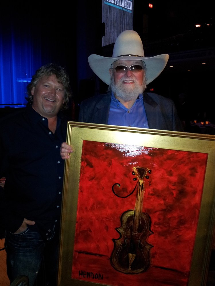  Hendon presenting “Fiddle of Gold” piece to Charlie Daniels, 2012. 