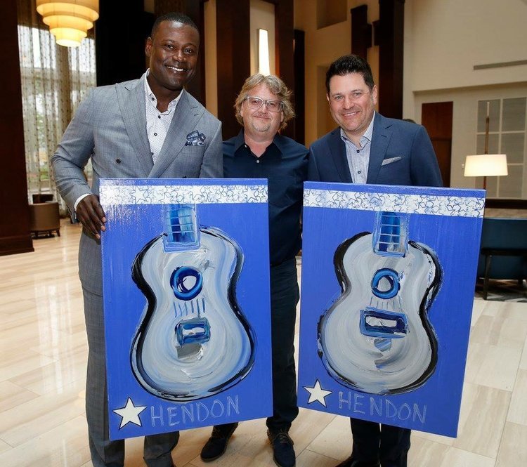  Hendon presenting works alongside former collegiate and NFL player, Kevin Carter and Jay Demarcus of the Rascal Flatts for the Make-A-Wish Foundation, 2017.     