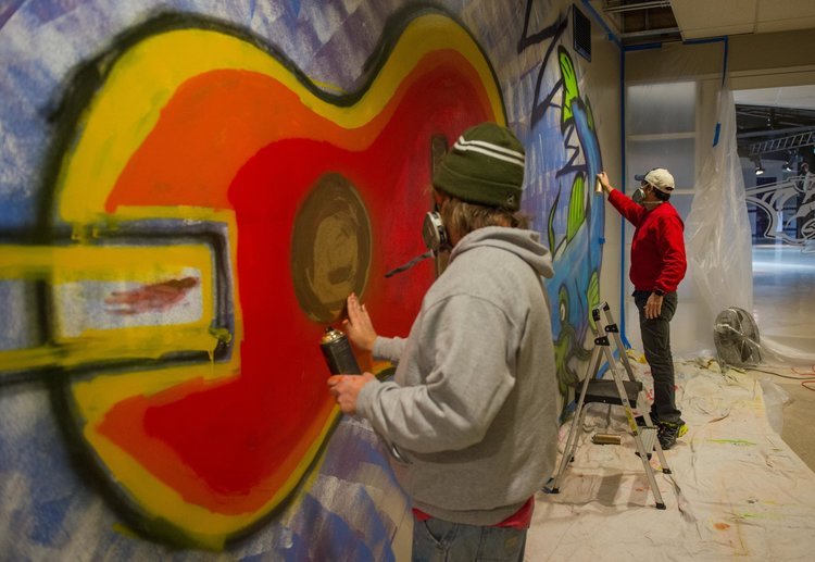  Hendon applying layers to mural for Bridgestone Arena, Nashville, TN. 