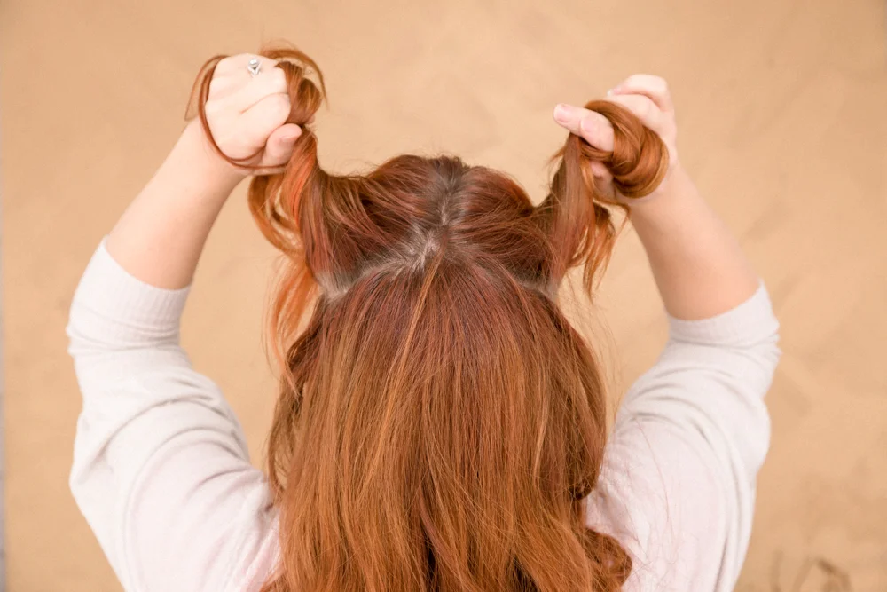 Brush hair. Part your hair at the crown from ear to ear. Divide in half, clip one side out of the way.