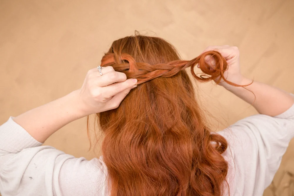Lightly pull on each braided strand to loosen/deconstruct braid.