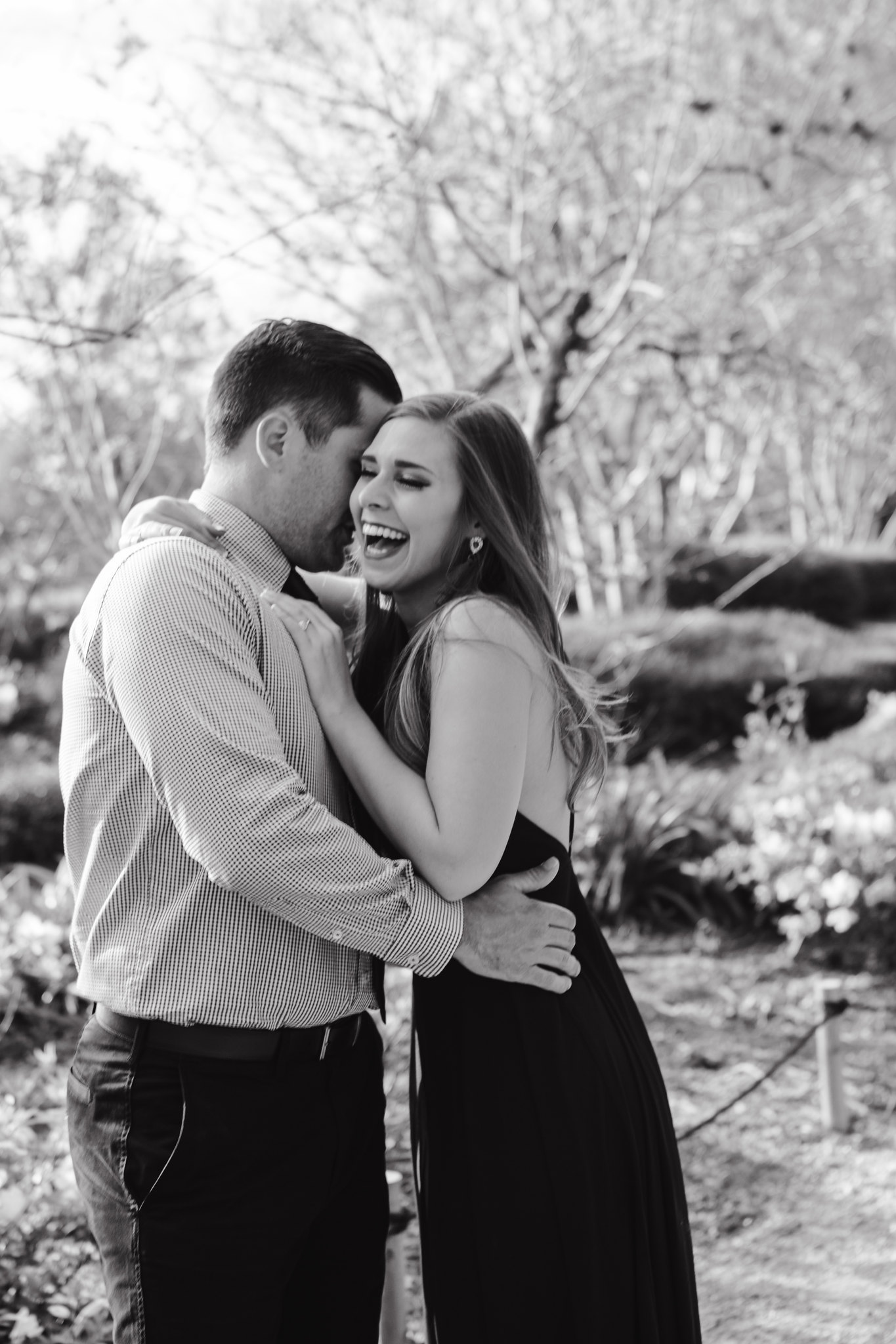 Couple hugging laughing Engagement Photo Session at Hermann Park Houston, TX