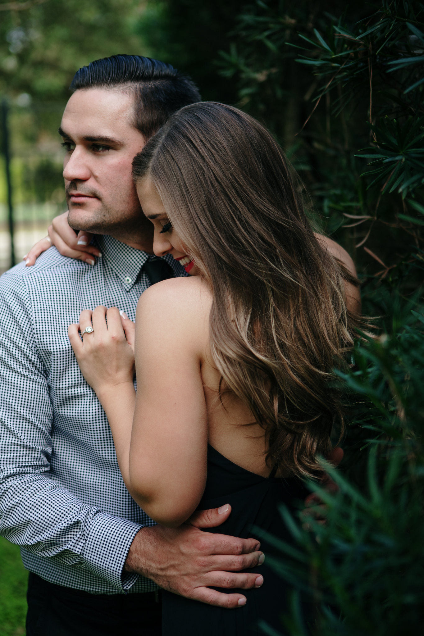 Couple hugging intimate Engagement Photo Session at Hermann Park Houston, TX