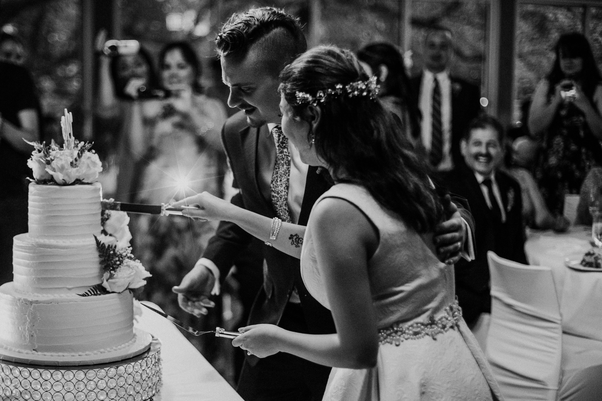 Bride and groom cake cutting. Reception. Wedding at The Grove at Discovery Green Park (Houston, TX)