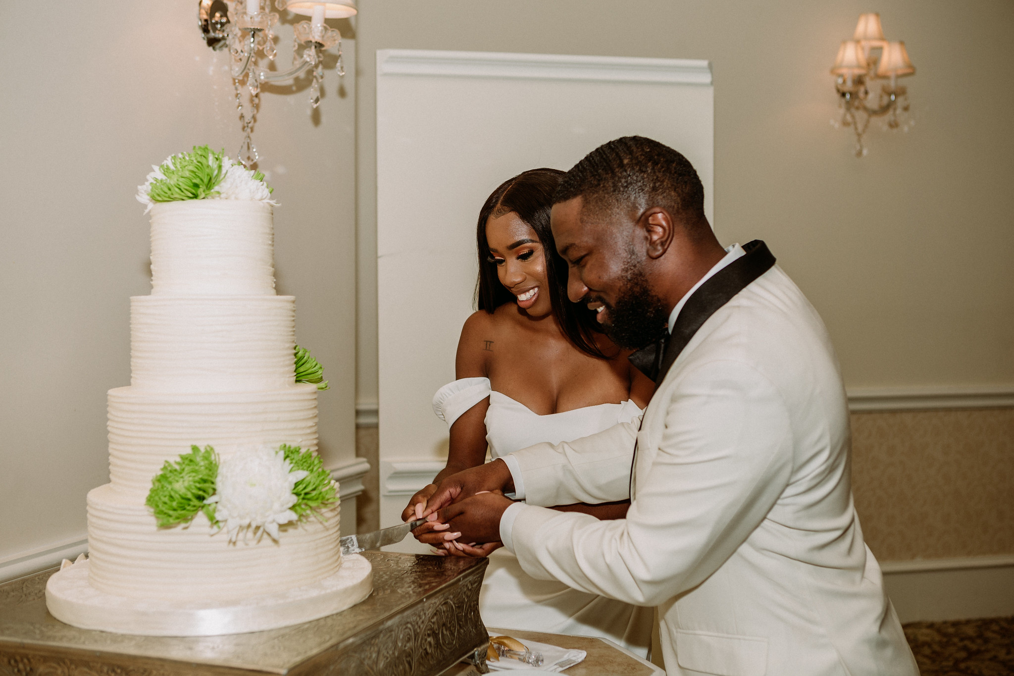 Bride and groom cake cutting. Reception. Wedding at Ashton Gardens West (Houston, TX)