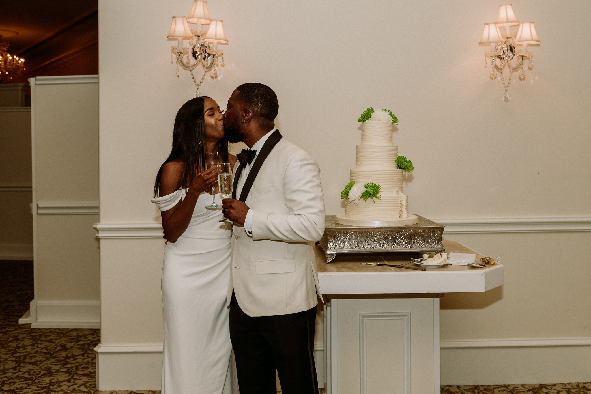 Bride and groom cake cutting. Reception. Wedding at Ashton Gardens West (Houston, TX)