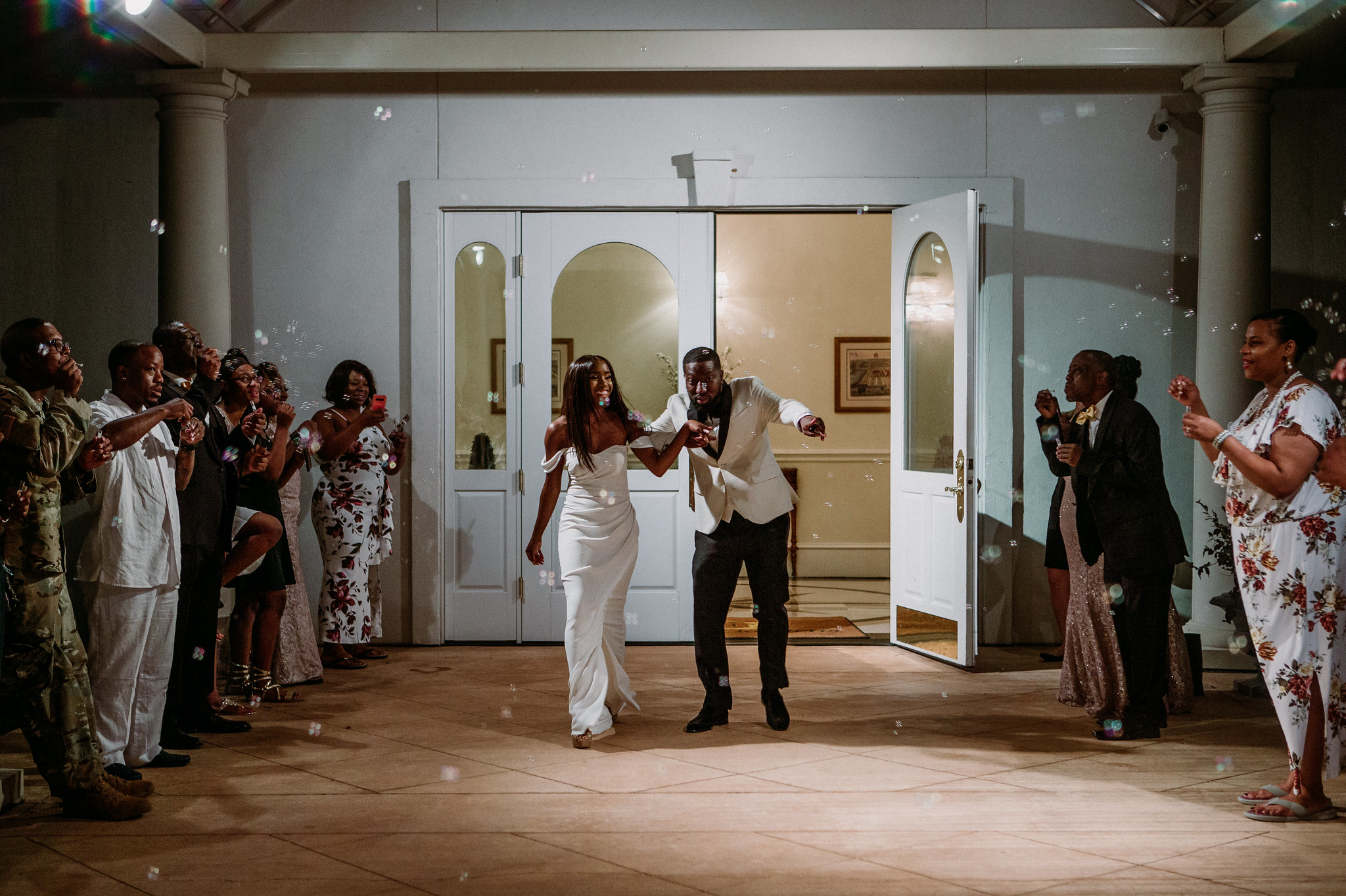 Bride and groom grand exit send off bubbles. Wedding at Ashton Gardens West (Houston, TX)