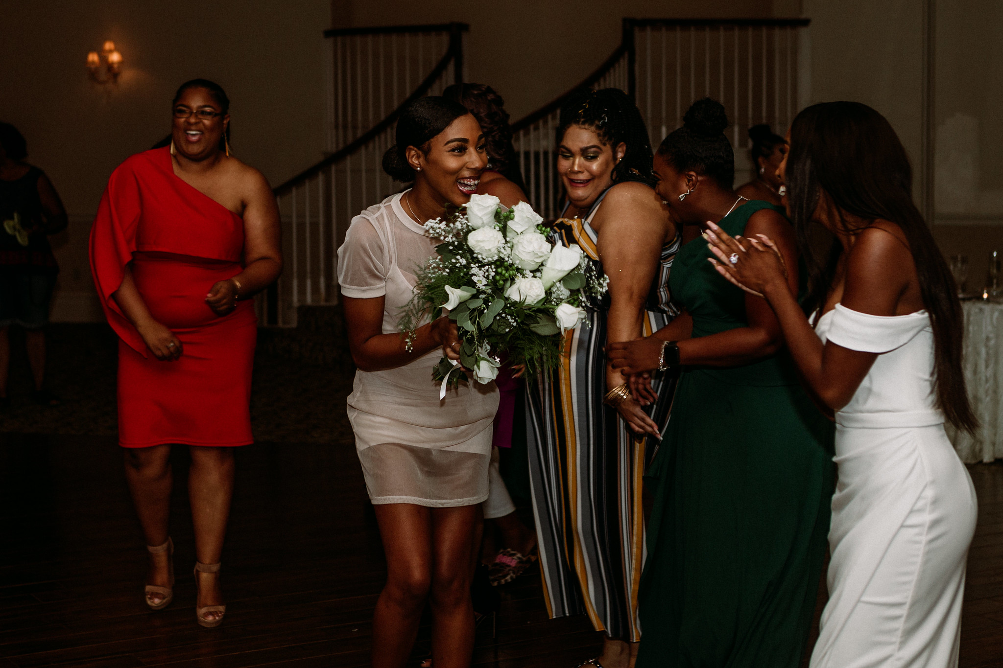 Bouquet toss. Reception. Wedding at Ashton Gardens West (Houston, TX)