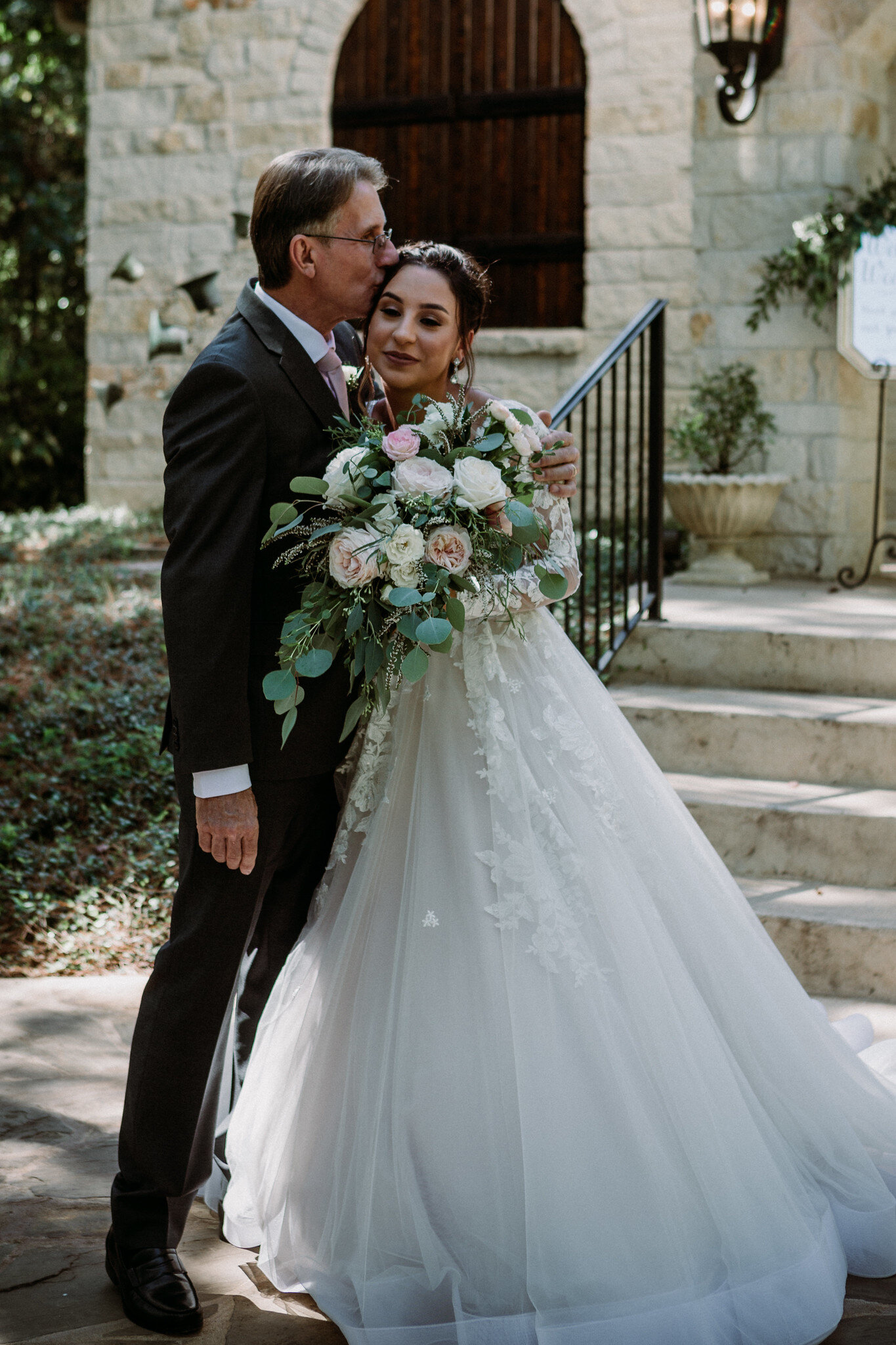 Bride first look with dad. Wedding at Magnolia Bells (Magnolia, TX)