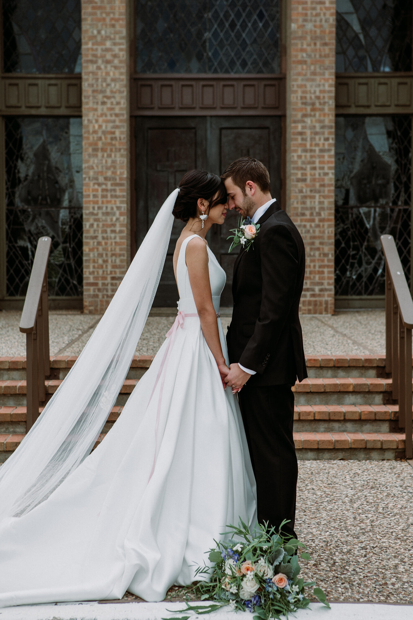 Bride and groom portraits holding hands. Captivating Micro Wedding Grace Lutheran Church in Brenham, TX