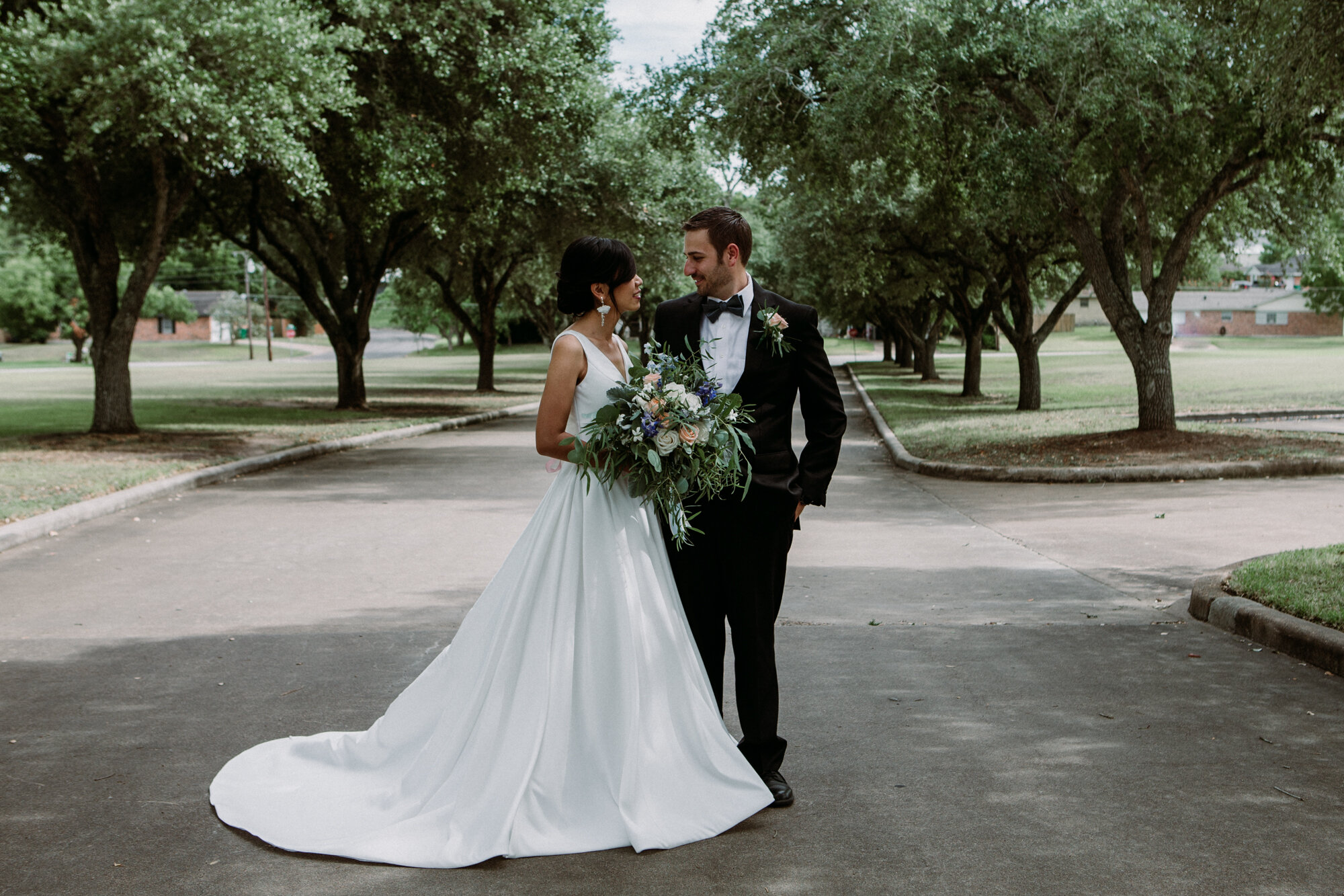 Bride and groom portraits with live oaks. Captivating Micro Wedding Grace Lutheran Church in Brenham, TX