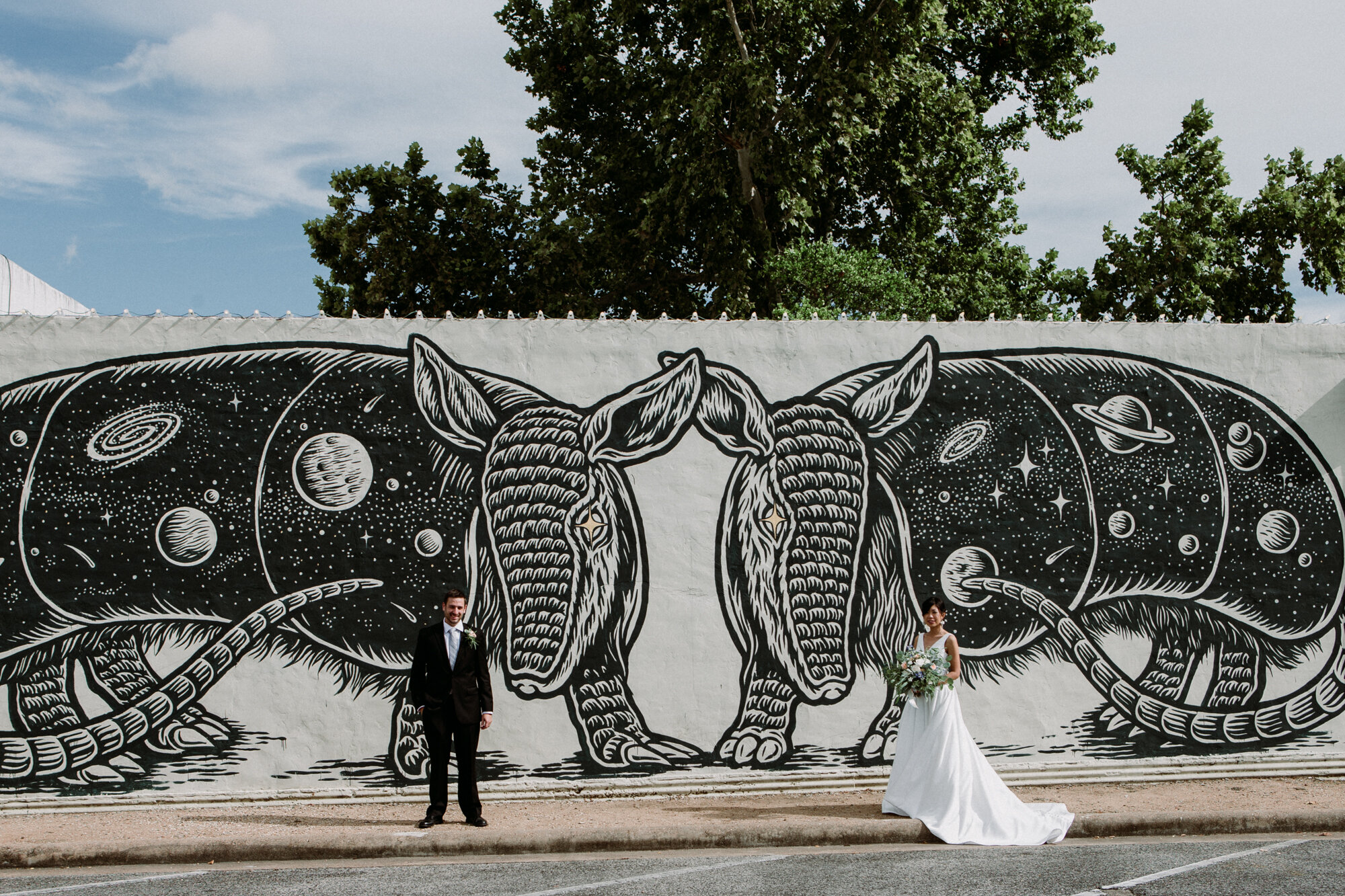 Captivating Micro Wedding Bride and Groom Couples Portraits Murals Armadillos Downtown Brenham, TX