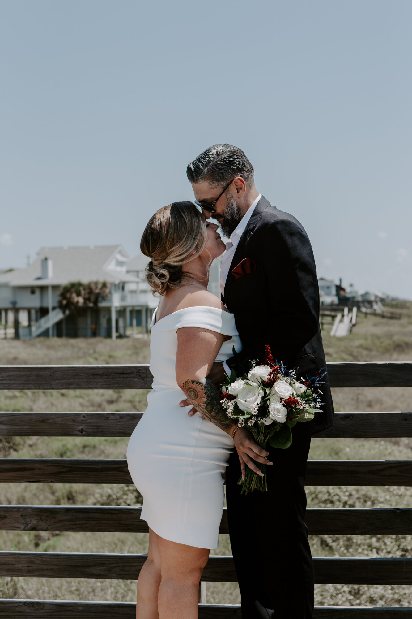 Bride and groom kiss first look. Intimate Elopement on the Beach