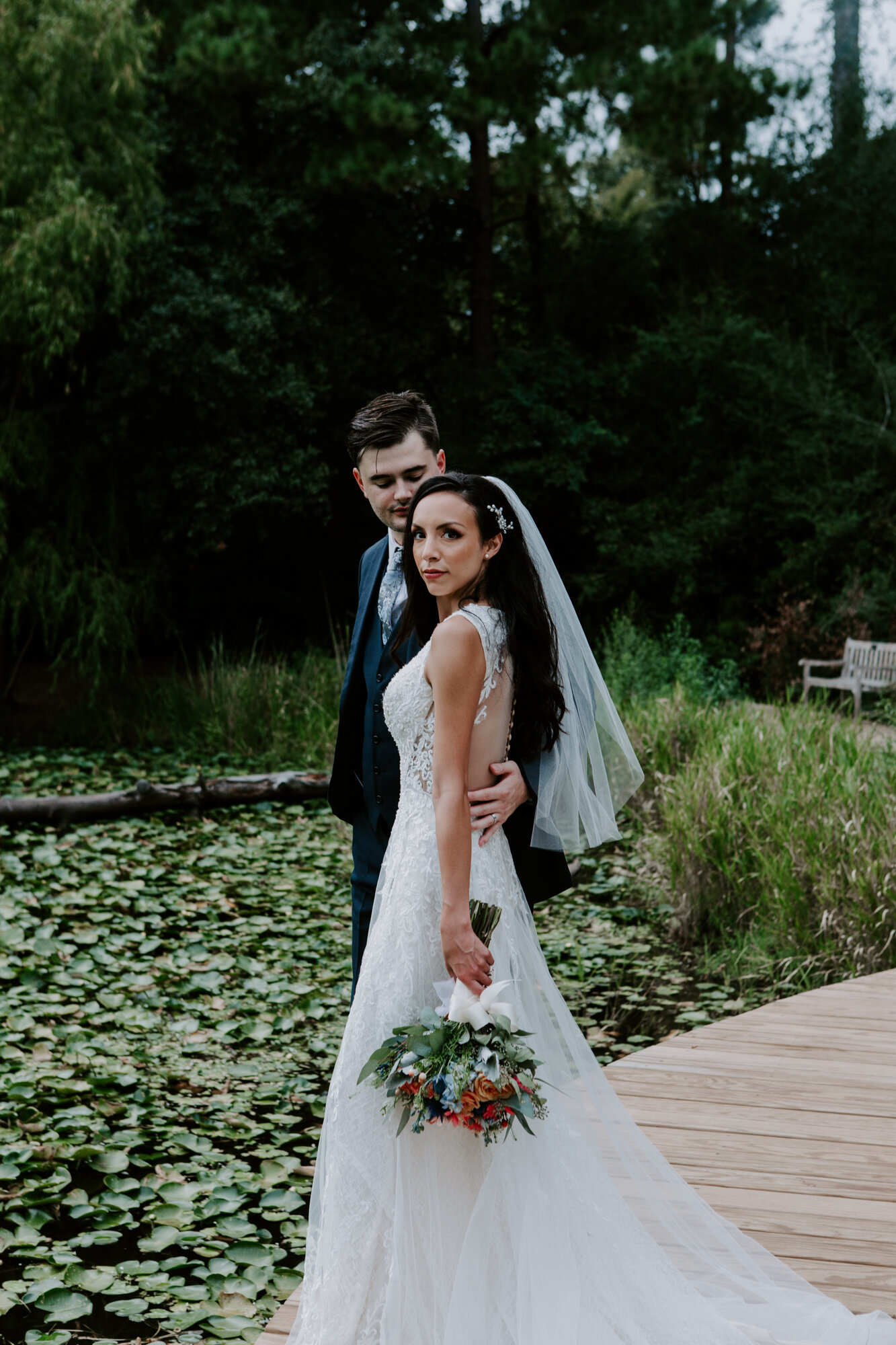 Bride and groom portraits by the pond. Vivacious Wedding at Houston Arboretum and Nature Center