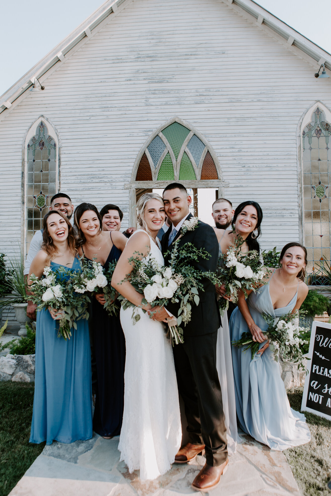 Bride and groom with bridal party having fun. Radiant Bohemian Hill Country Wedding at Gruene Estate in New Braunfels, TX