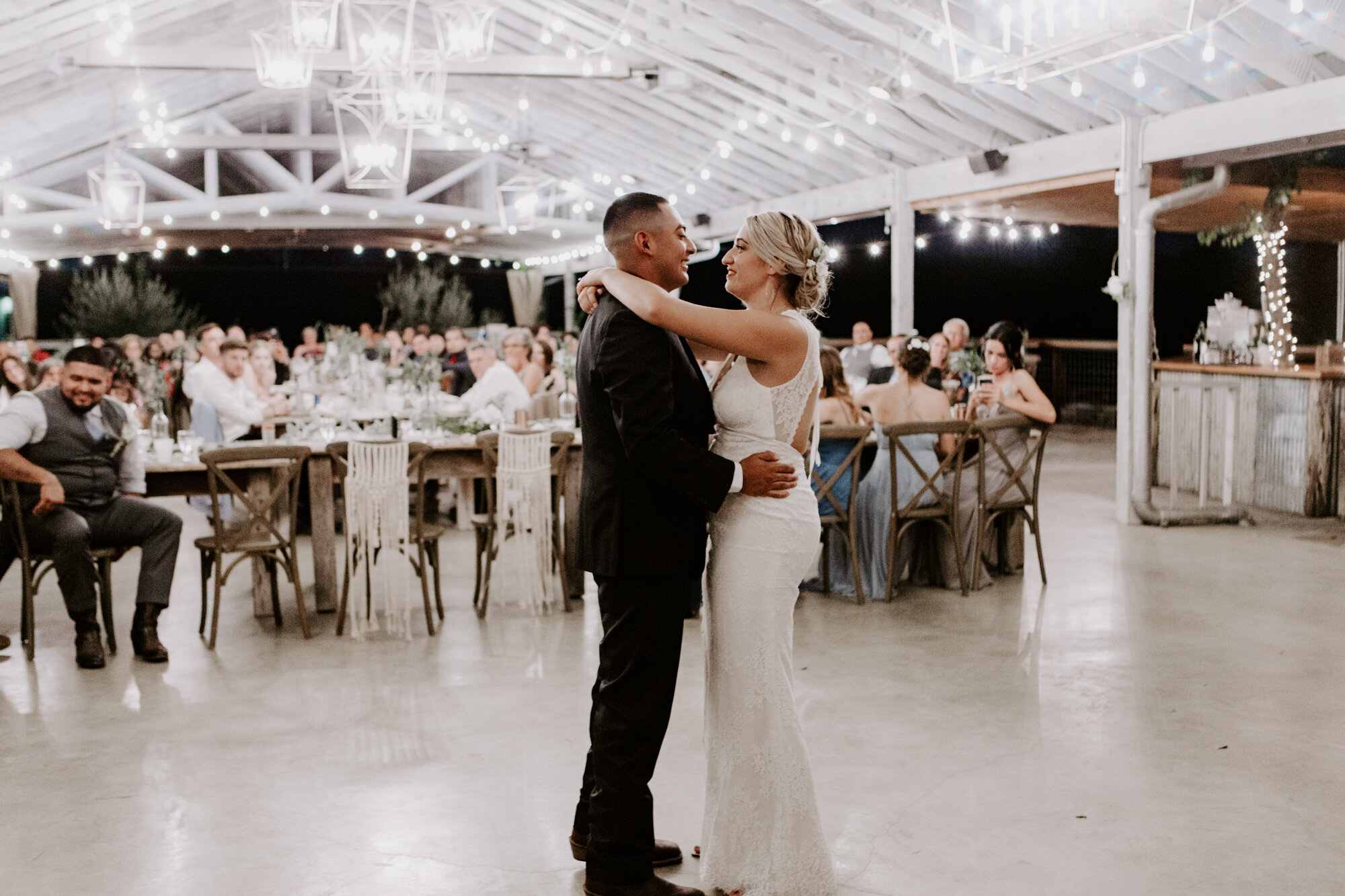 Bride and groom first dance. Radiant Bohemian Hill Country Wedding at Gruene Estate in New Braunfels, TX