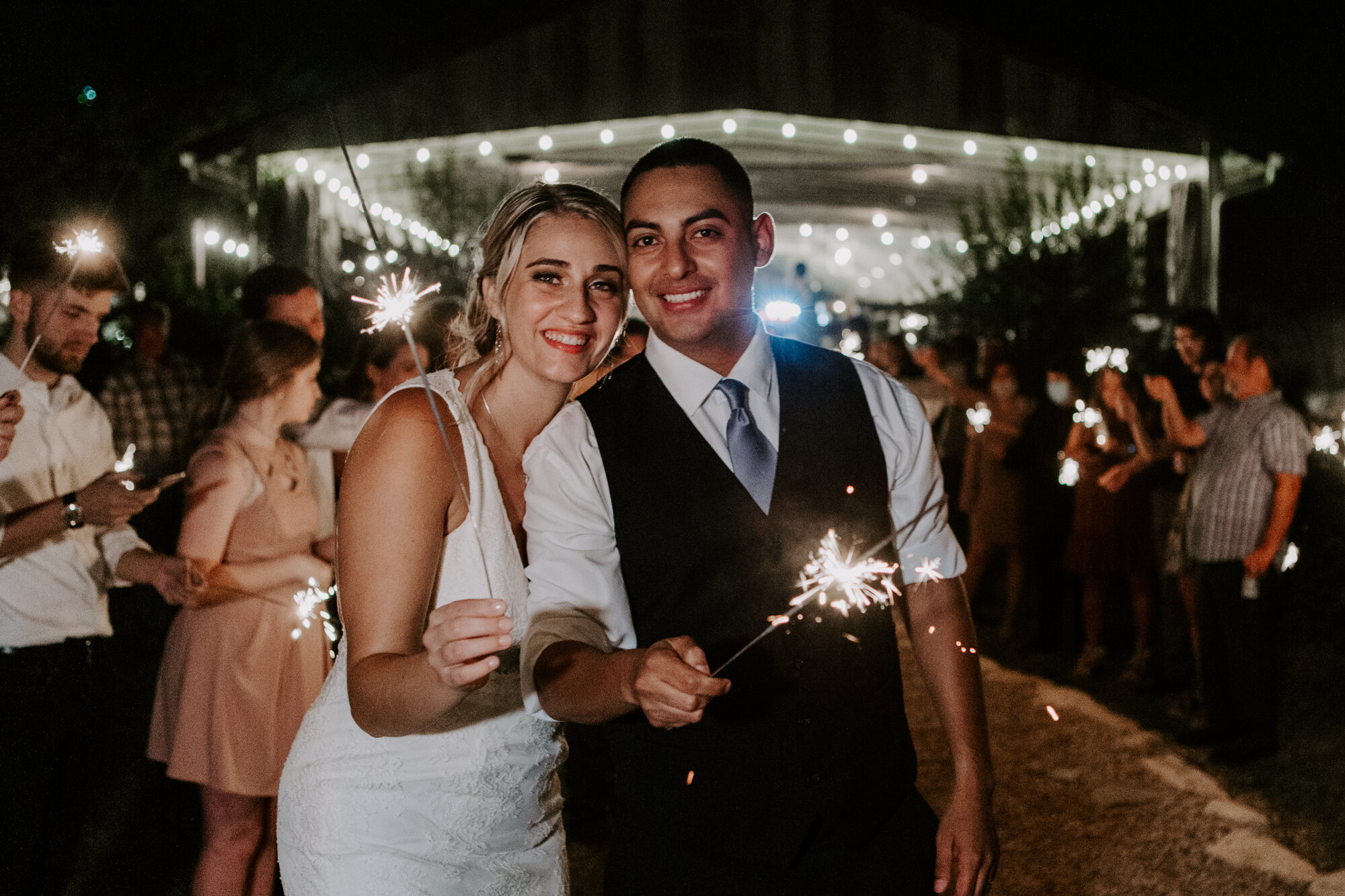 Bride and groom grand exit send off with sparklers. Radiant Bohemian Hill Country Wedding at Gruene Estate in New Braunfels, TX