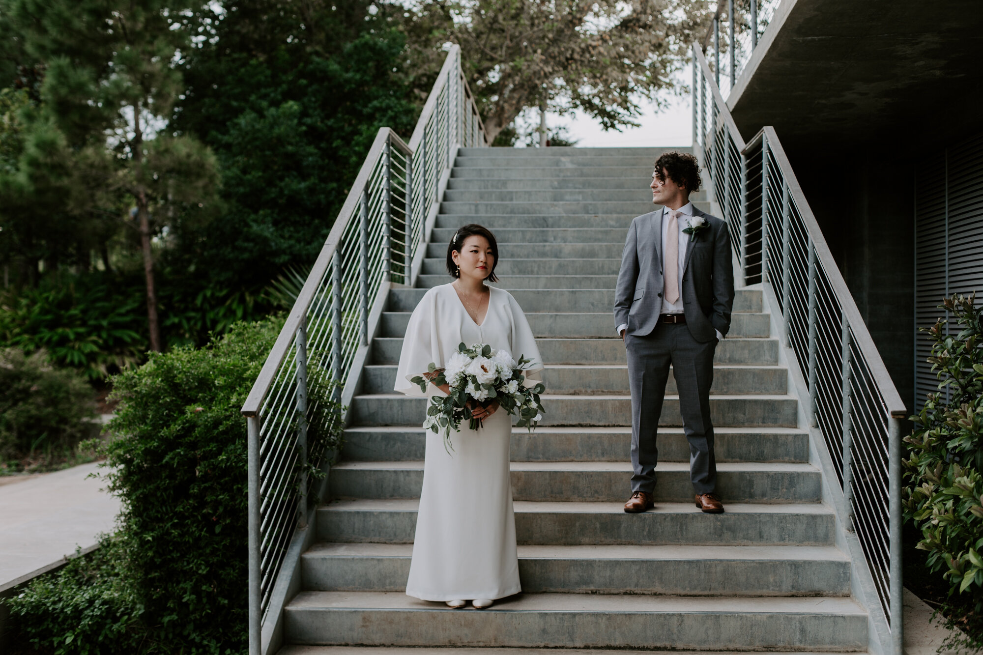 Modern cool on the staircase. Bride and Groom Wedding Photo Session at The Lost Lake Buffalo Bayou Park