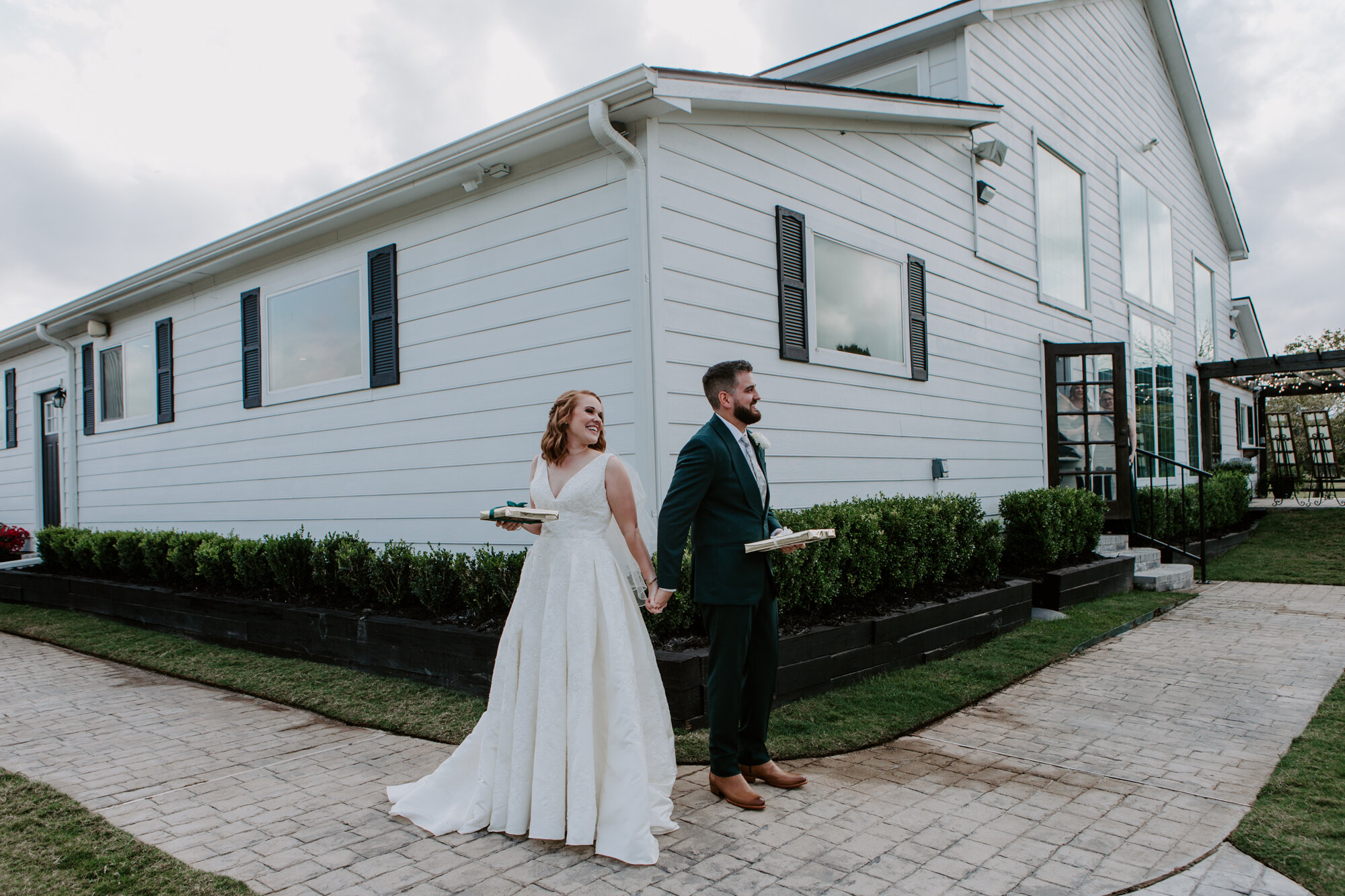 Blind first look reading vows bride and groom. Mesmerizing Wedding in Emerald Green at Venue 311 in Plantersville, TX 