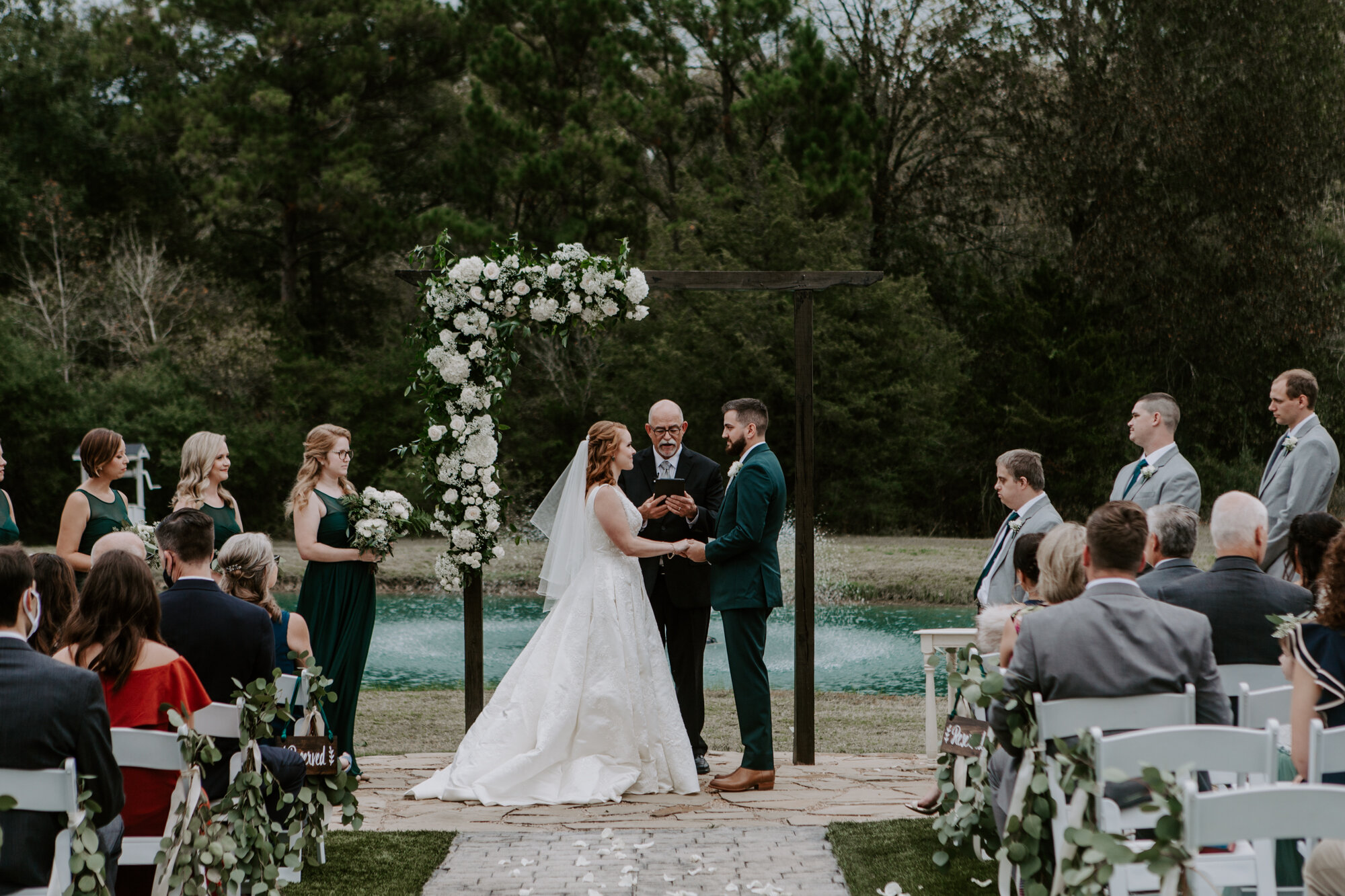 Mesmerizing Wedding Ceremony outdoors in Emerald Green at Venue 311 in Plantersville, TX 