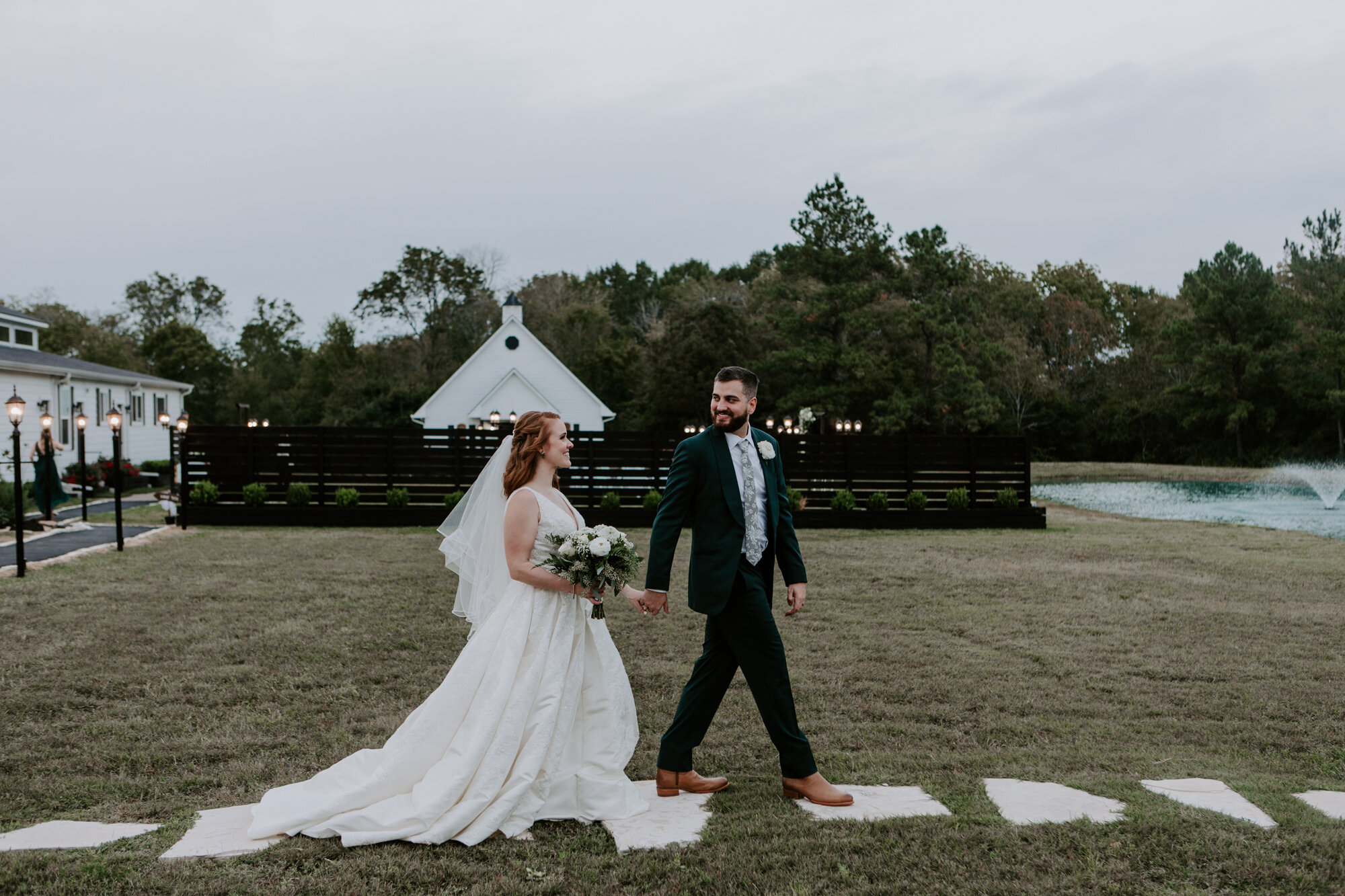 Bride and groom follow me shot. Mesmerizing Wedding in Emerald Green at Venue 311 in Plantersville, TX 
