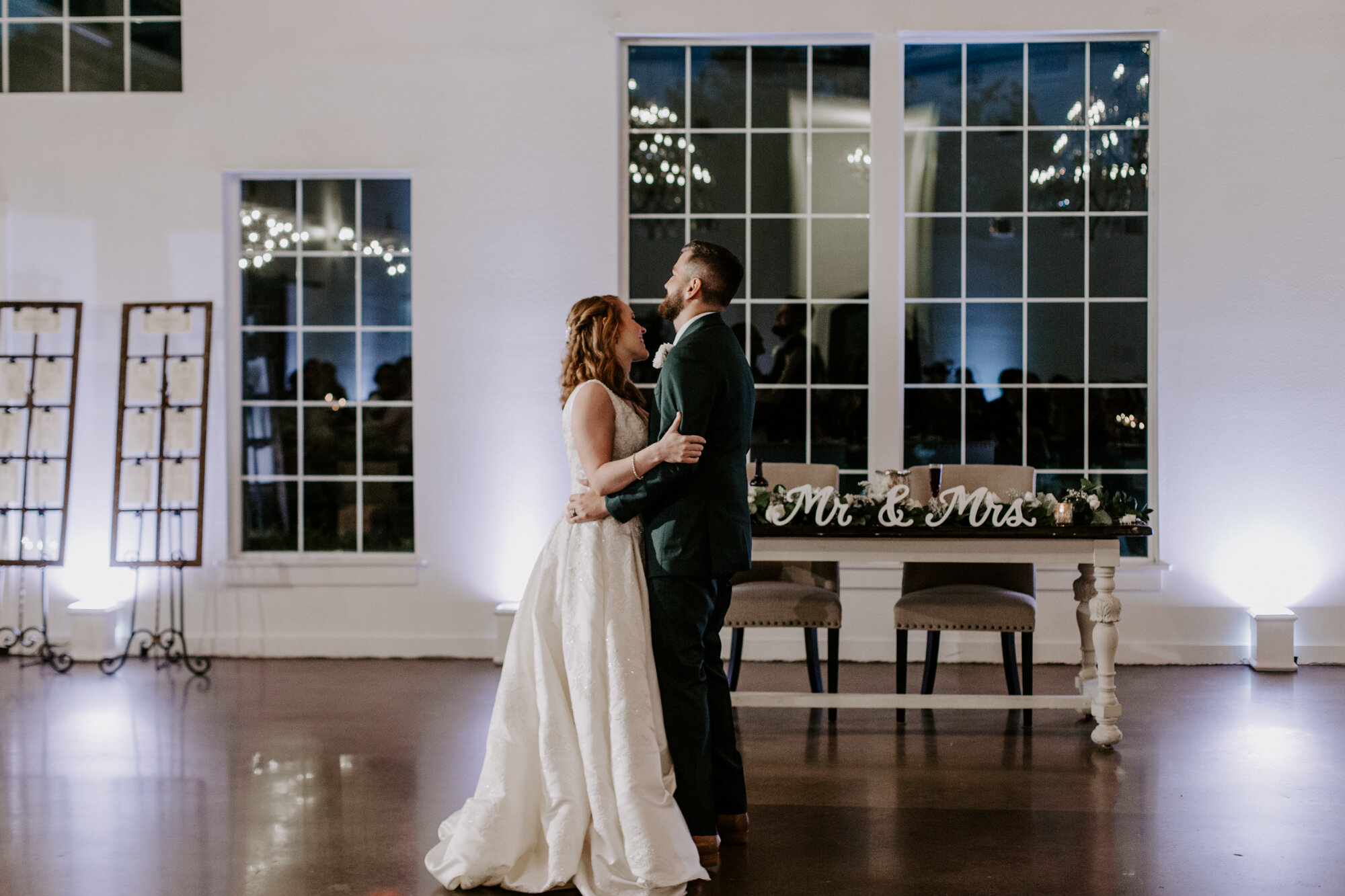 Bride and groom first dance. Mesmerizing Wedding in Emerald Green at Venue 311 in Plantersville, TX
