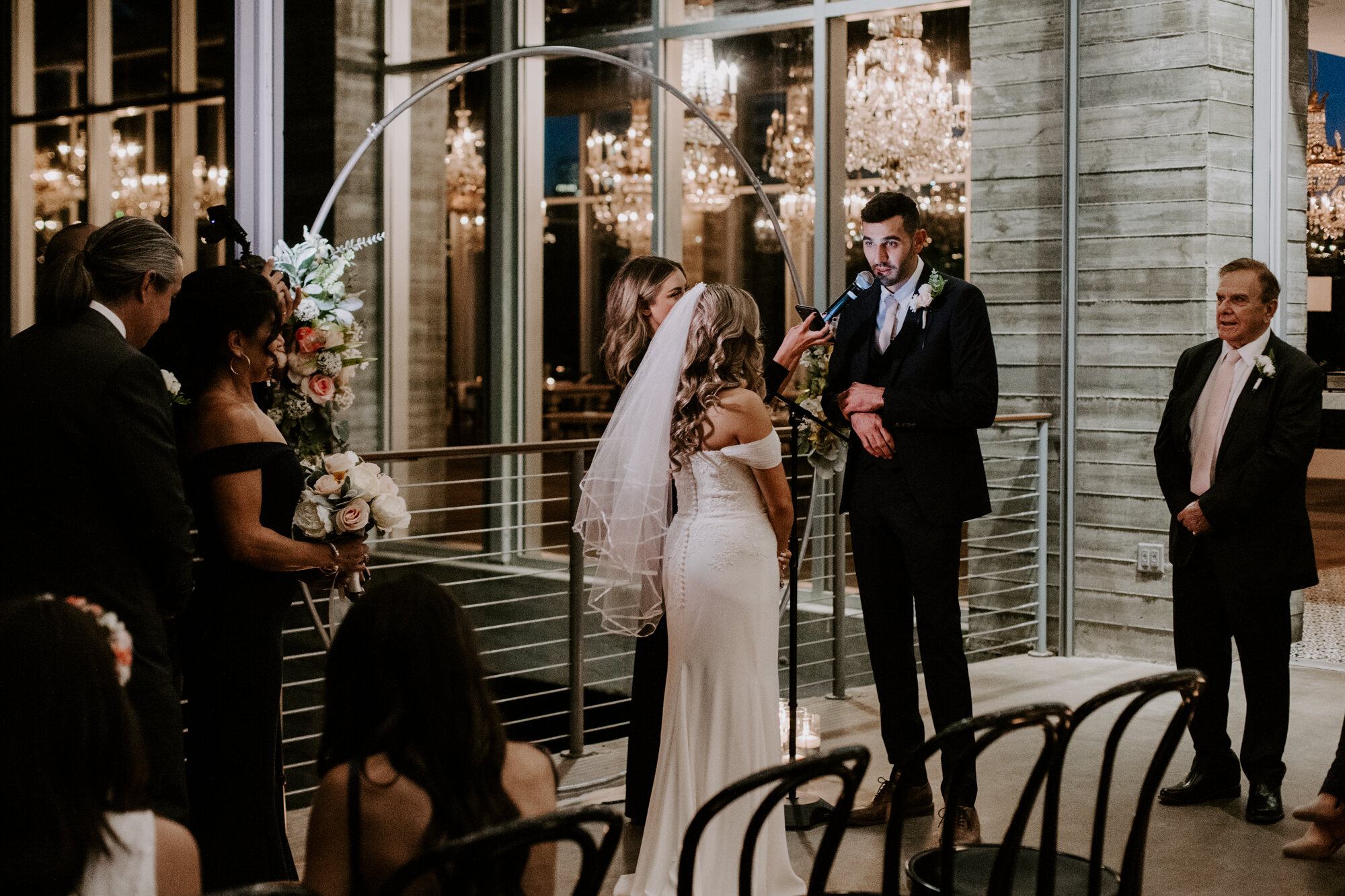 Groom reading vows to bride. Glamorous Wedding at The Dunlavy and the Lost Lake Buffalo Bayou Park 
