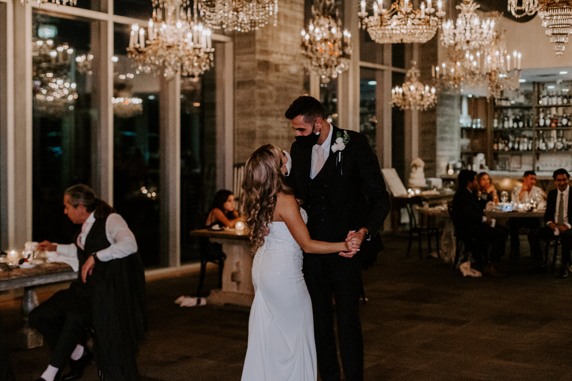 Bride and groom quarantine COVID-19 fist dance wearing masks. Glamorous Wedding at The Dunlavy and the Lost Lake Buffalo Bayou Park