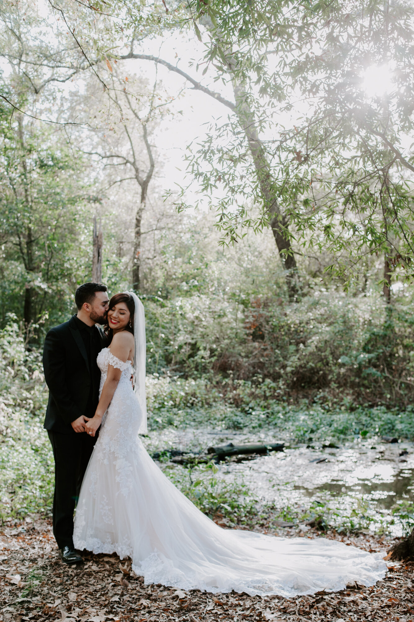 Kissing in the sunlight. Trash the Dress Bride and Groom Photo Session at Houston Arboretum and Nature Center