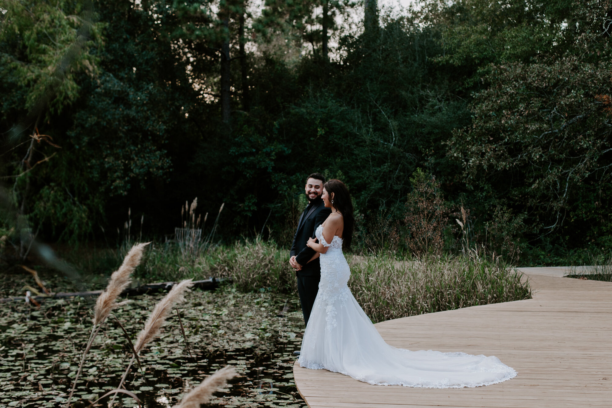 By the pond. Trash the Dress Bride and Groom Photo Session at Houston Arboretum and Nature Center