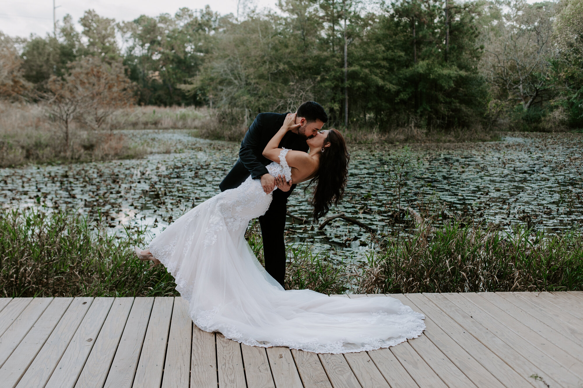 Dip and kiss. Trash the Dress Bride and Groom Photo Session at Houston Arboretum and Nature Center