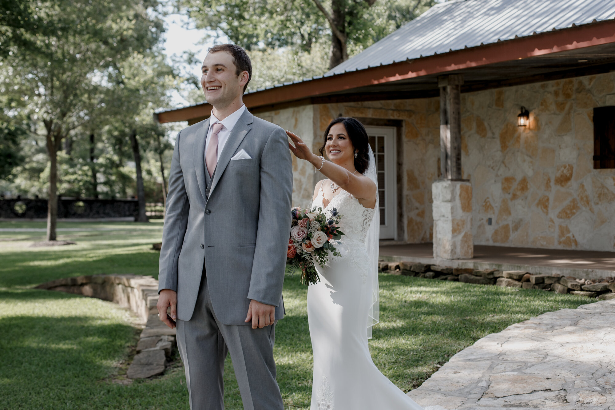 Bride and groom first look. Romantic Chic Country Wedding at Rustic Luxury Balmorhea Events&nbsp;Venue in Magnolia, TX