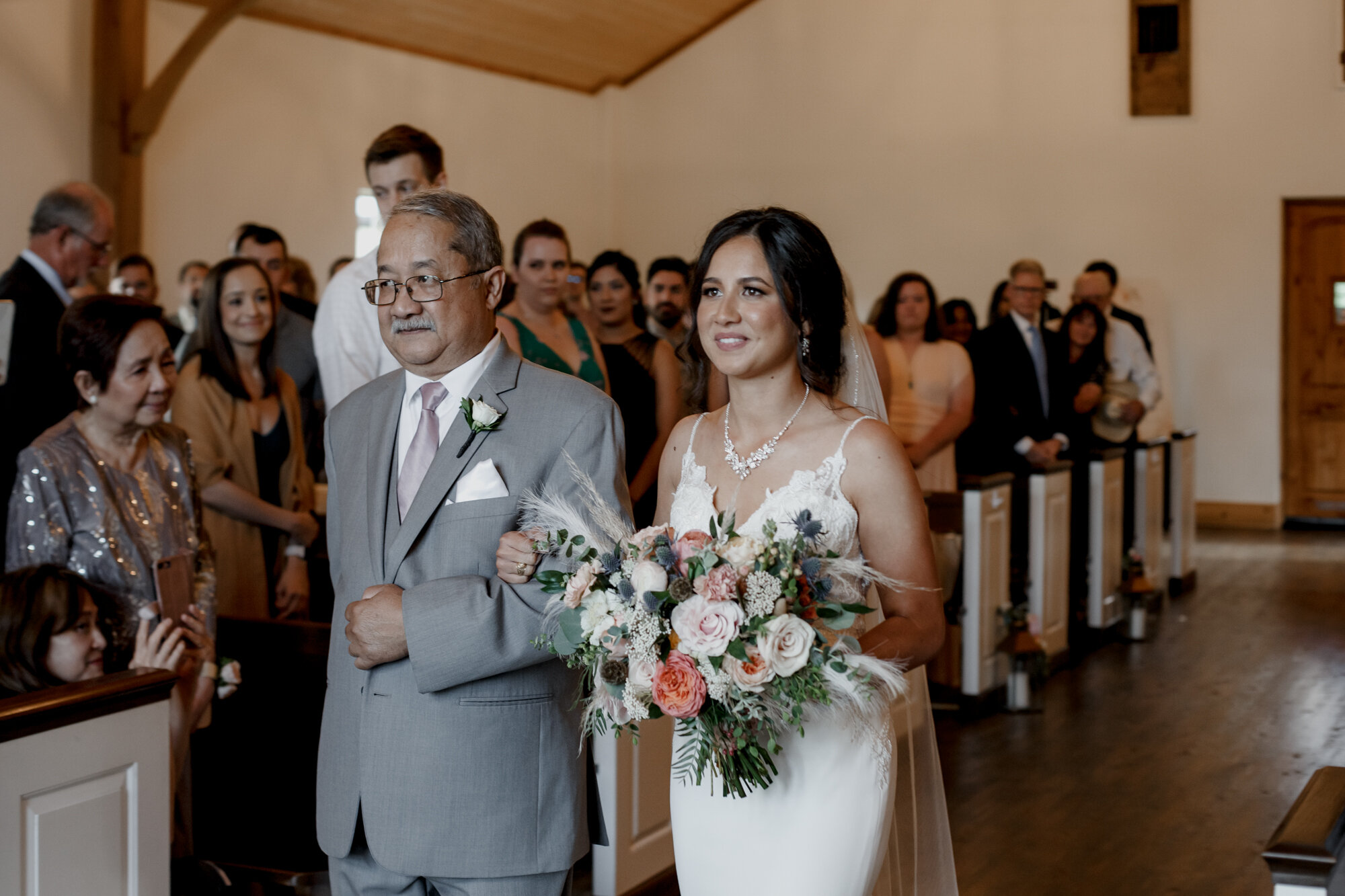 Father and bride walking down the aisle. Romantic Chic Country Wedding at Rustic Luxury Balmorhea Events&nbsp;Venue in Magnolia, TX