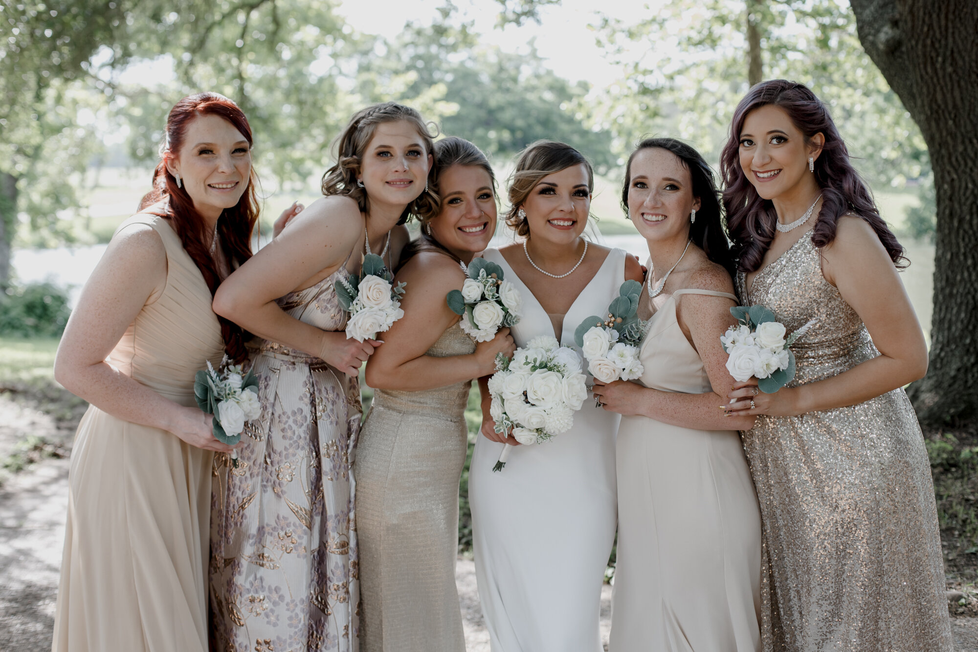 Bride and bridesmaids portraits. Glowing Wedding in Golden Champagne Tones at The Orchard at Caney Creek in Wharton, TX