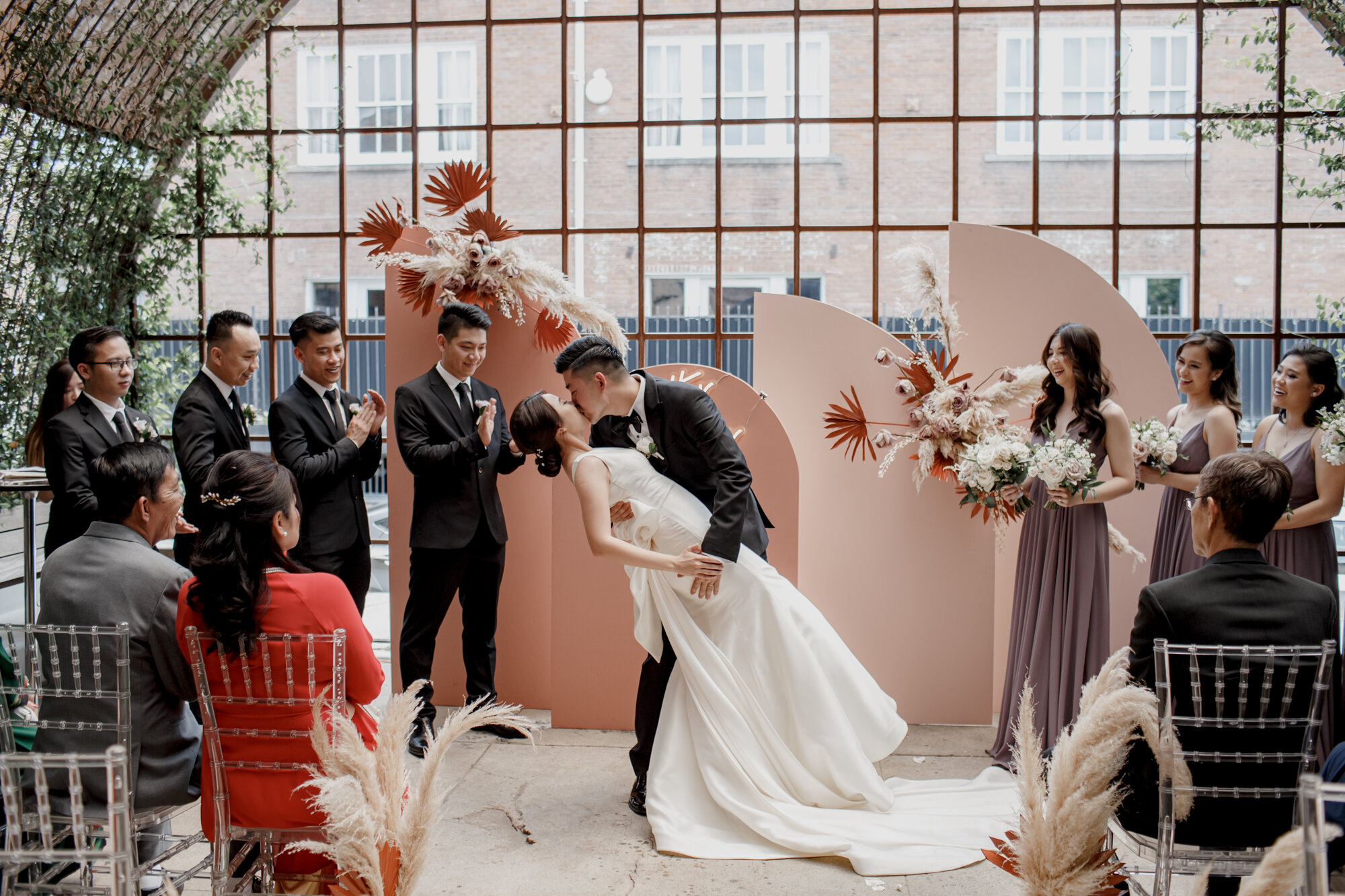 Bride and groom first kiss. Urban Elegant East Asian Wedding at Ronin 2