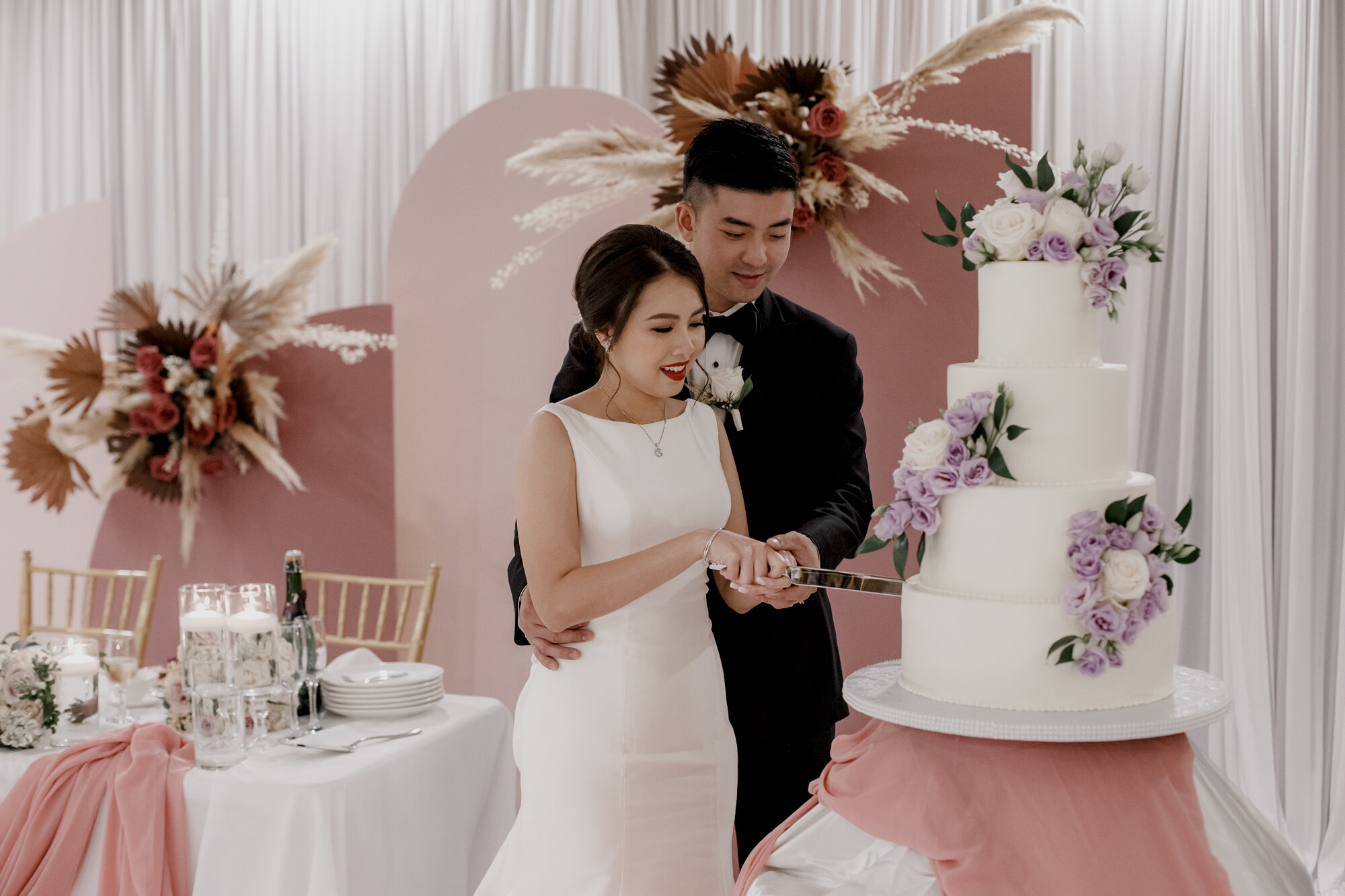 Bride and groom cutting the cake. Urban Elegant East Asian Wedding at Chateau De L’Amour