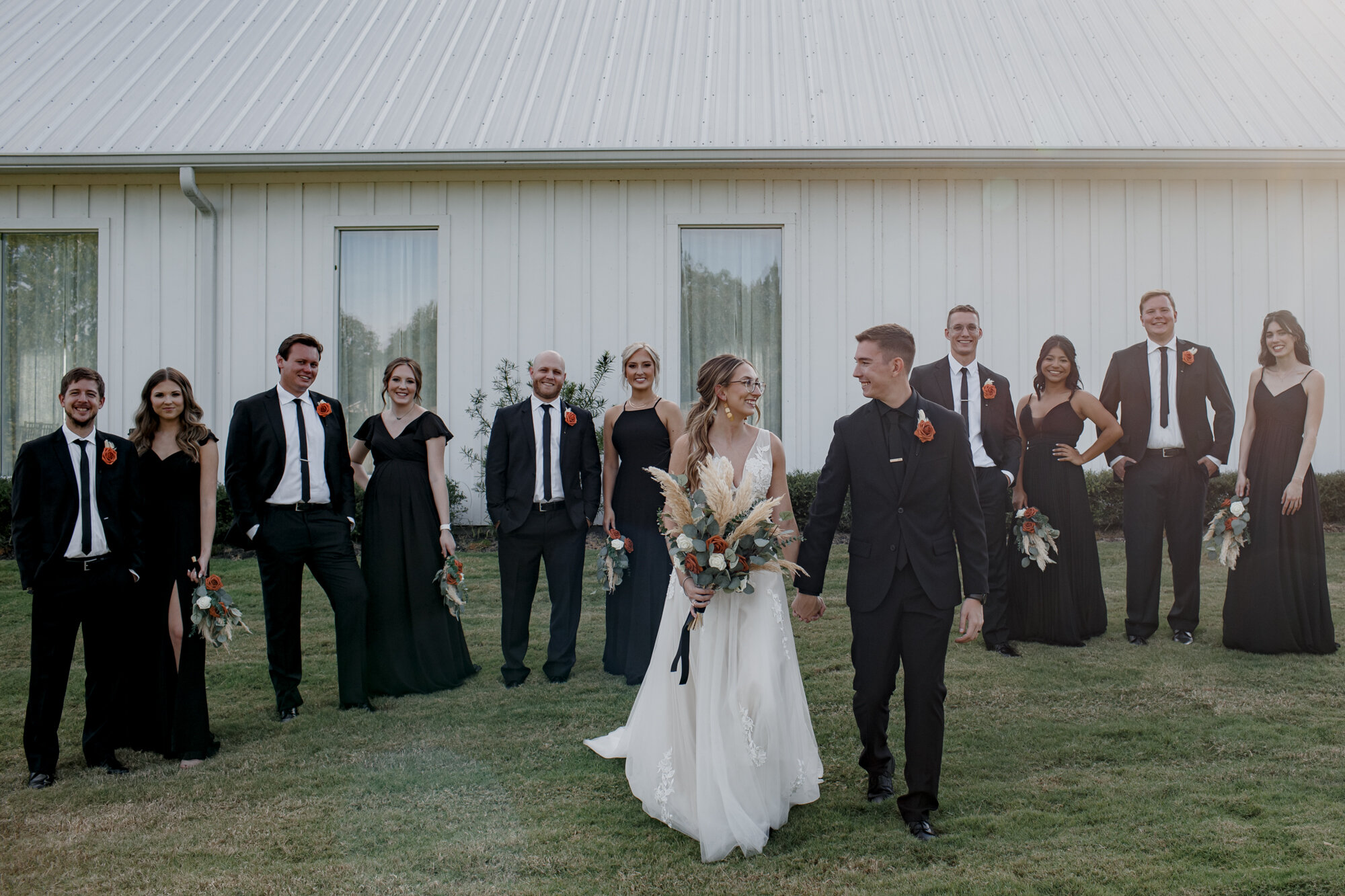 Bride and groom portraits with bridal party. Burnt Orange and Black Fall Wedding at The Farmhouse