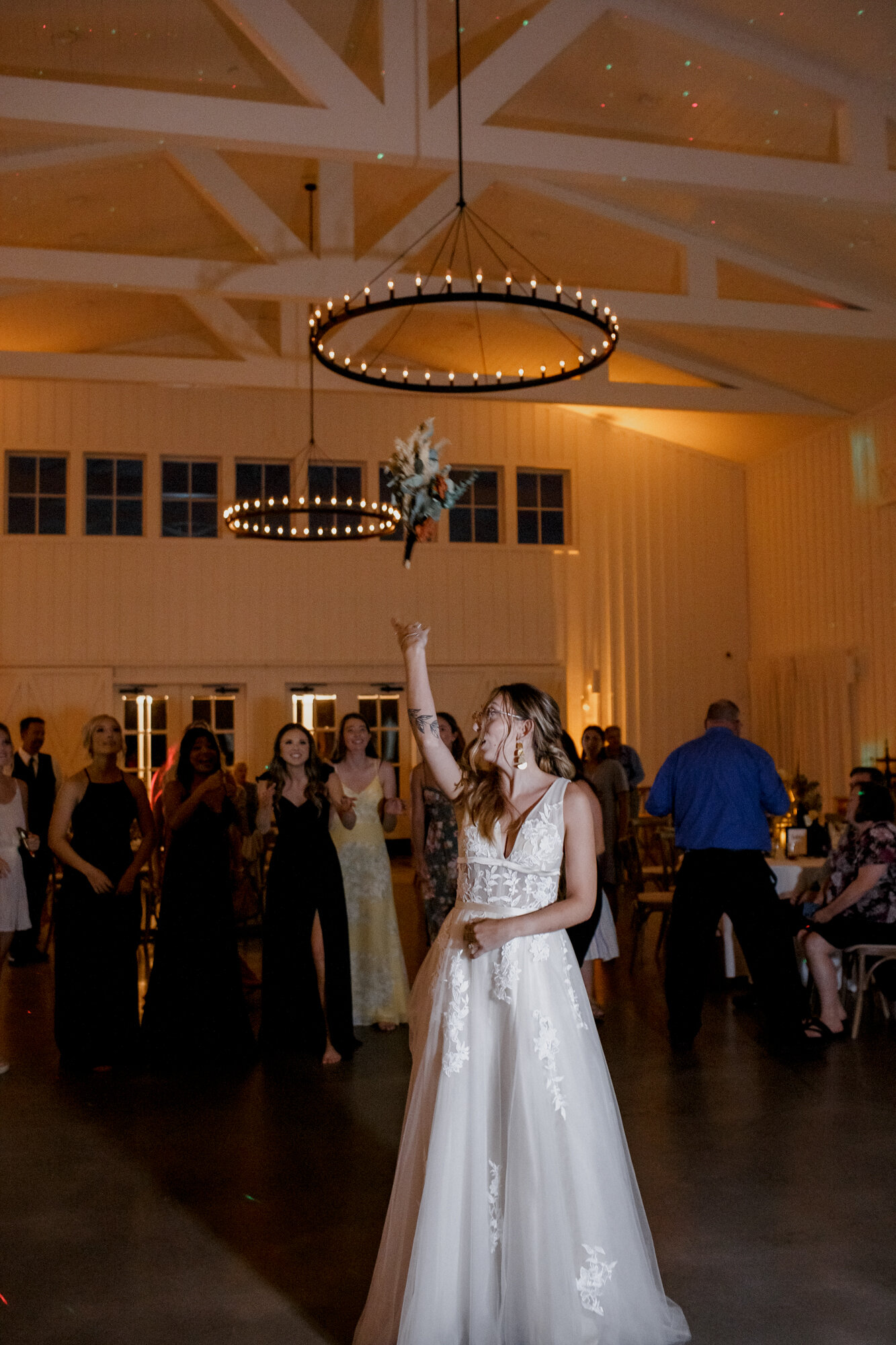 Bouquet toss. Burnt Orange and Black Fall Wedding at The Farmhouse