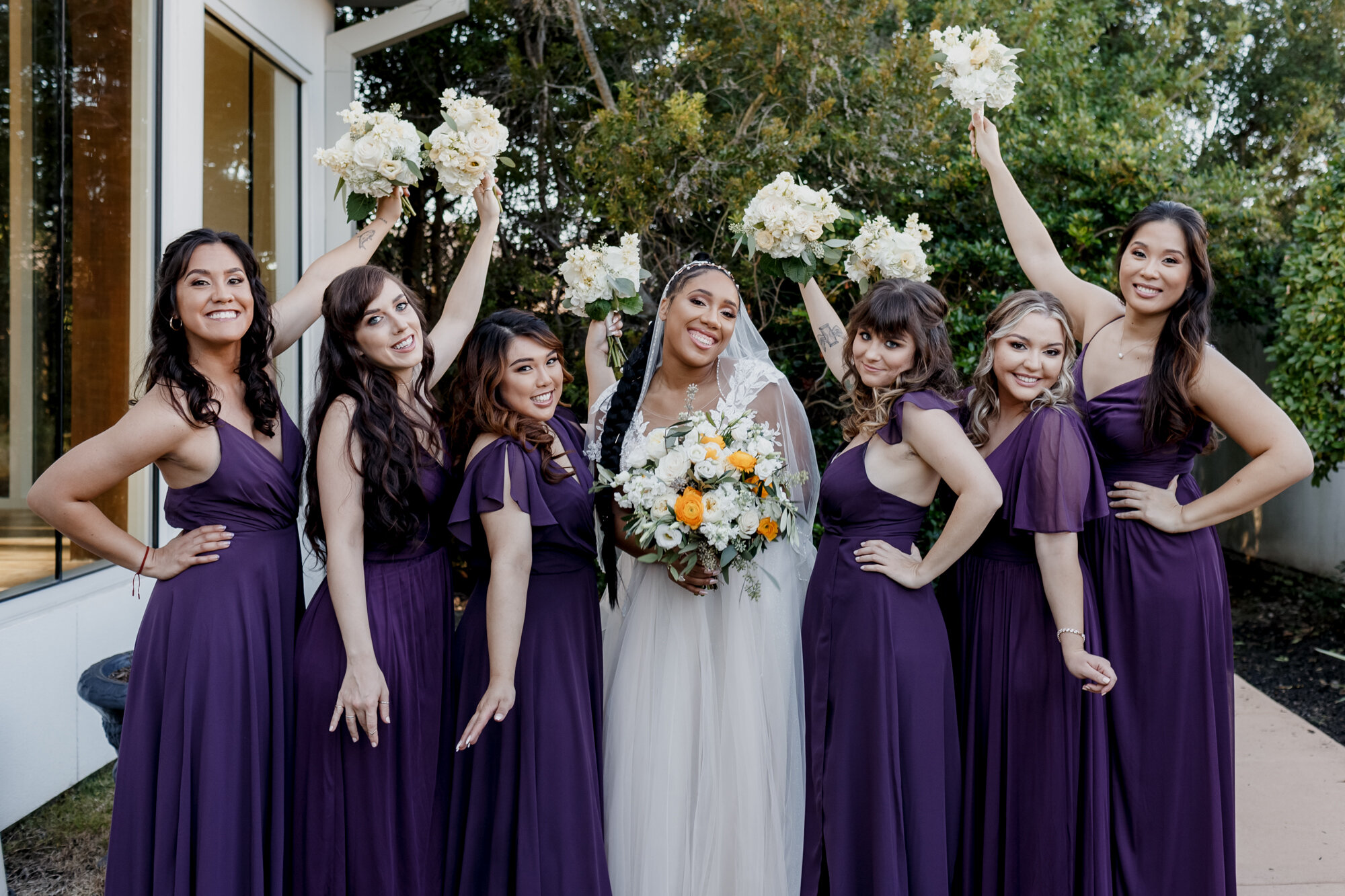 Bride and bridesmaids happy smiles. Elegant and Dazzling Wedding in Yellow and Purple at Ashton Gardens West