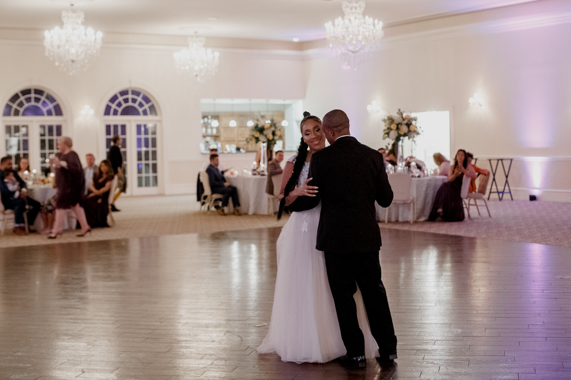 Bride and groom first dance. Elegant and Dazzling Wedding in Yellow and Purple at Ashton Gardens West