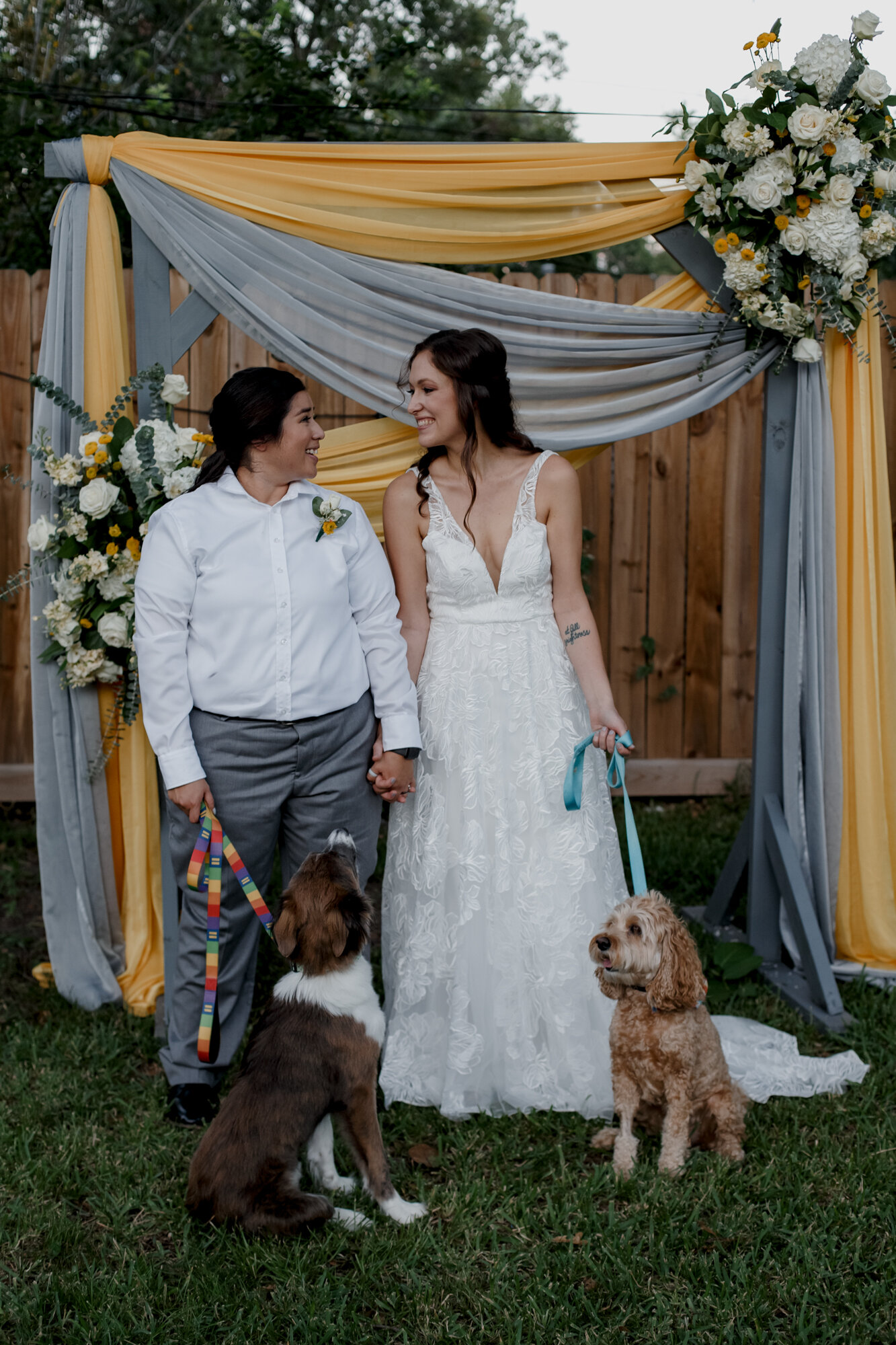 Cozy Laid-Back LGBTQ+ Backyard Wedding. Brides portraits with their dogs.