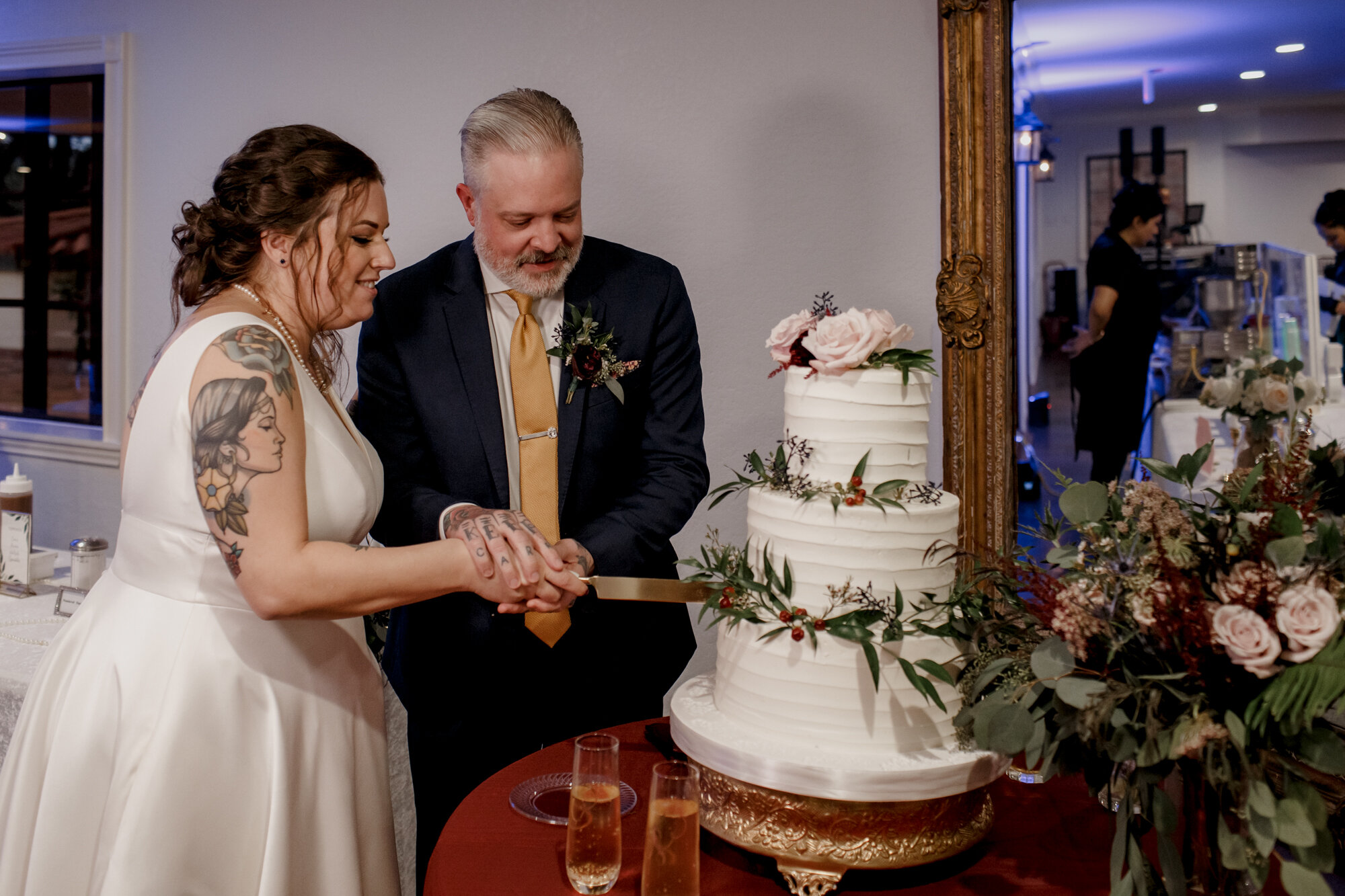 Bride and groom cutting the cake. Rock Star Wedding at The Gallery