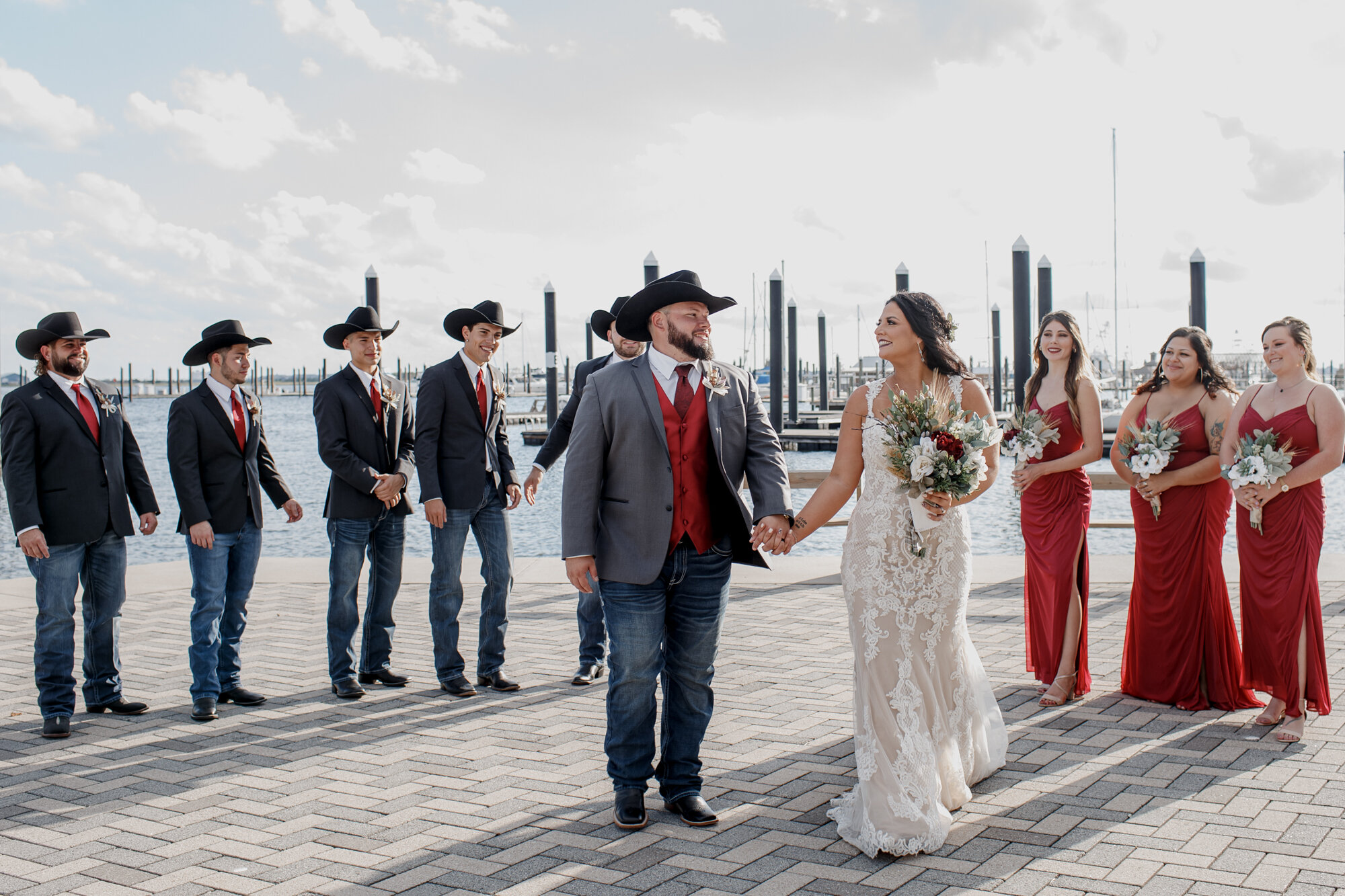 Bride and groom with bridal party. Fun and Glowing Wedding at Sea Star Base