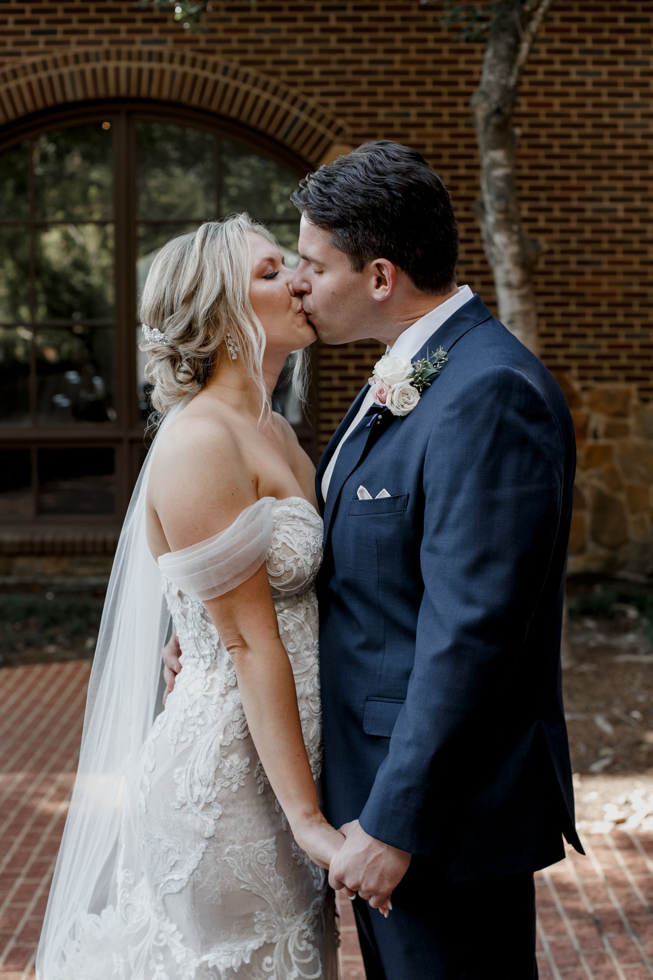 Bride and groom kiss portraits. Elegant and Glamorous Uptown Wedding at Omni Houston Hotel and The Wynden
