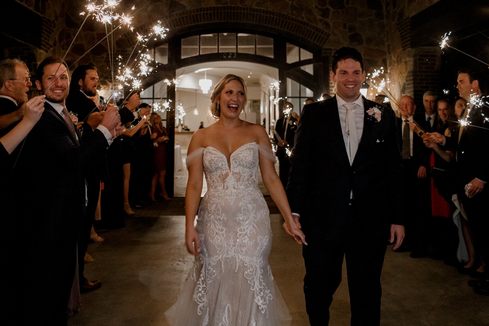 Bride and groom grand exit send off sparklers. Elegant and Glamorous Uptown Wedding at Omni Houston Hotel and The Wynden