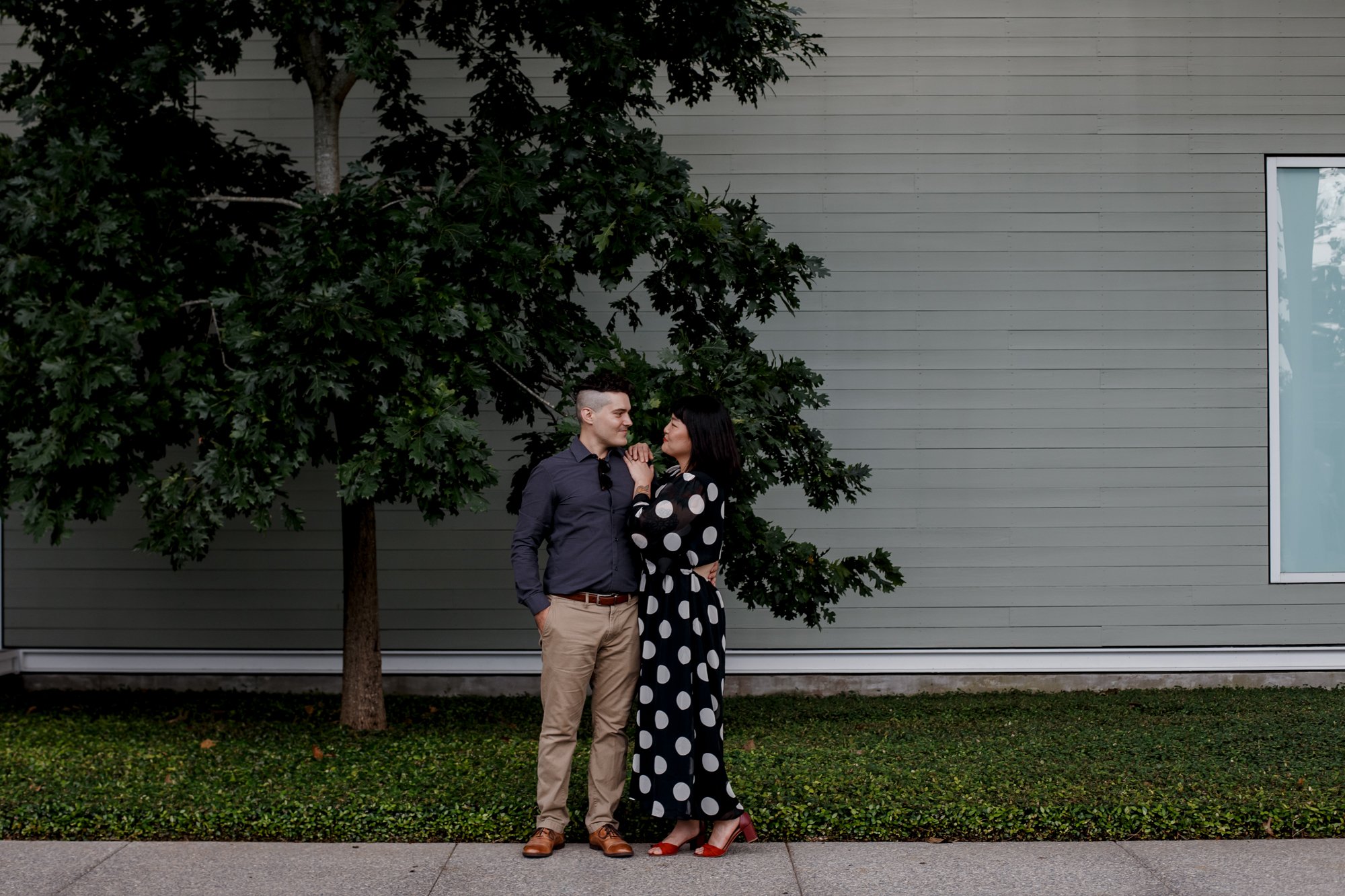 Couple hugging by the bamboo - Stylish Polka Dot Dress Engagement Photo Session at Menil Park