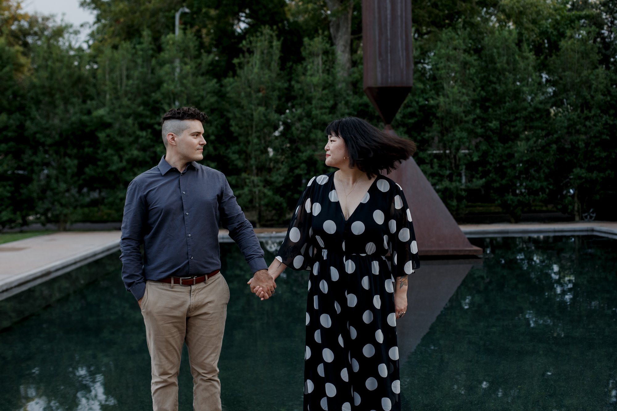 Letting that hair fly - Stylish Polka Dot Dress Engagement Photo Session by Rothko Chapel Sculpture