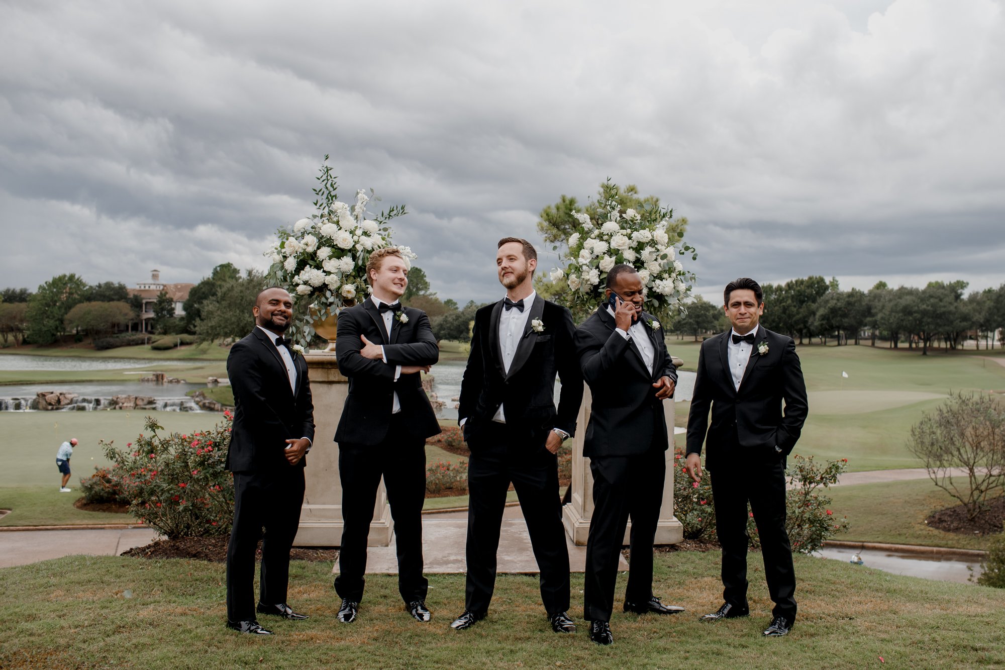 Groom and groomsmen posing looking cool. Wedding at Royal Oaks Country Club